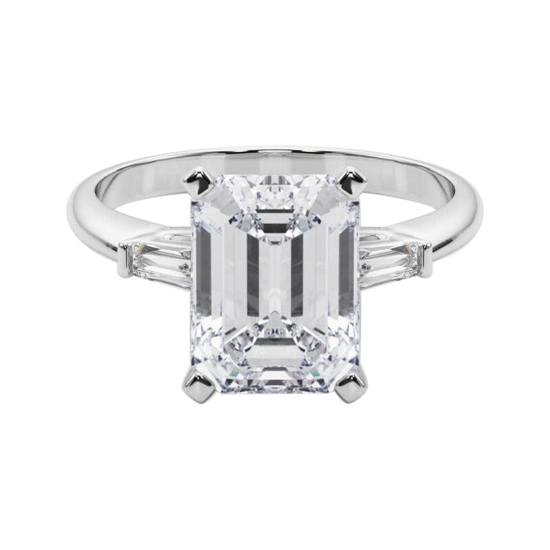 GIA 3.01ct Smeraldo a tre pietre Baguette affusolata Anello con diamanti in oro bianco 18 carati