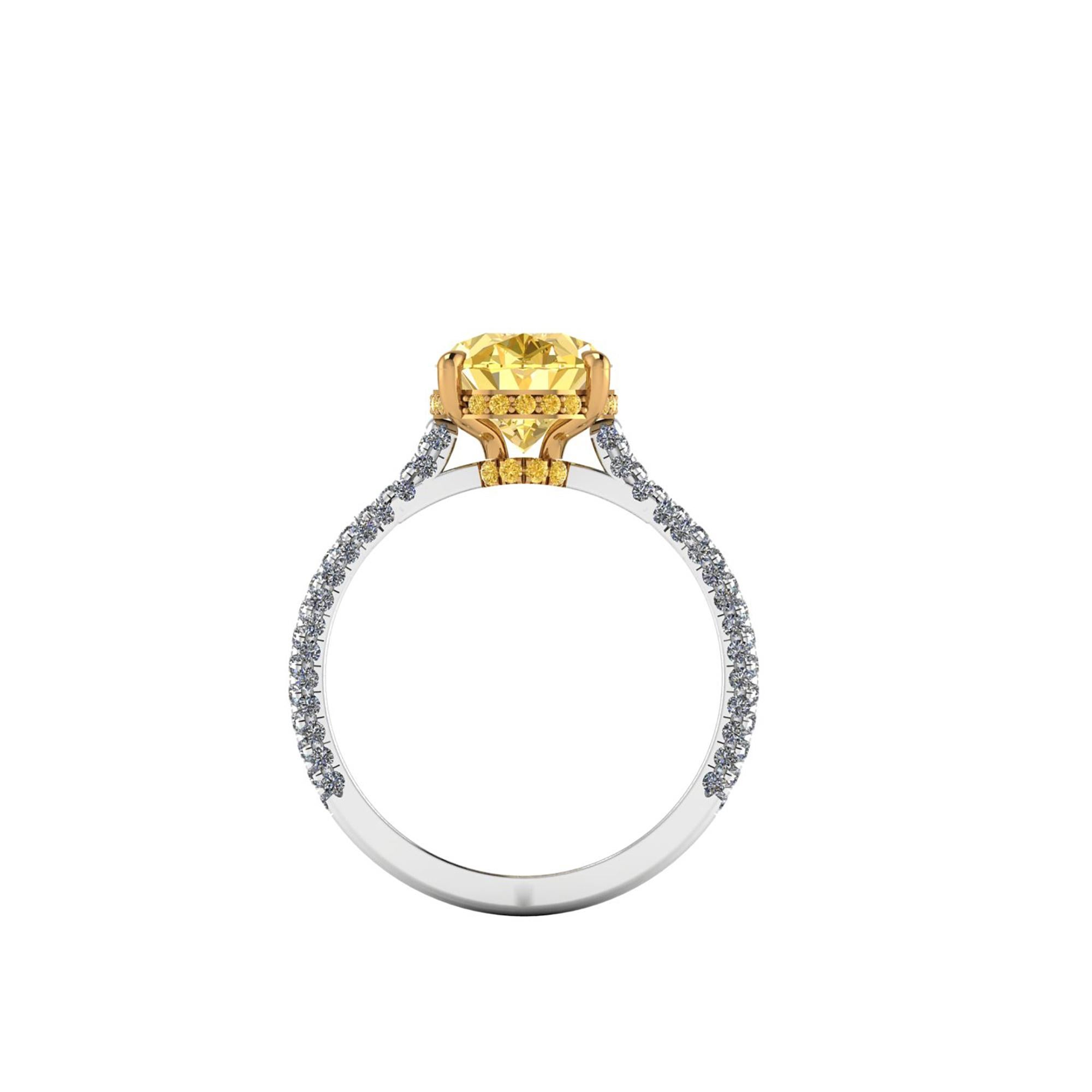 A very rare diamond in color and beauty, GIA Certified 3.06 carat Oval Vivid Intense Yellow diamond with No Fluorescence, a rare and valuable diamond, set on a Platinum 950 and 18k Yellow gold ring, designed and hand made in New York adorned by