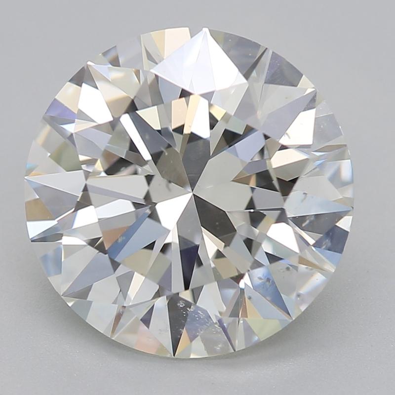 Handcrafted in New York, this stunning diamond ring features a captivating round 3.02 center stone, showcasing an impressive balance of size and sparkle. Set in a secure four-prong configuration, the centerpiece is crafted to highlight its beautiful