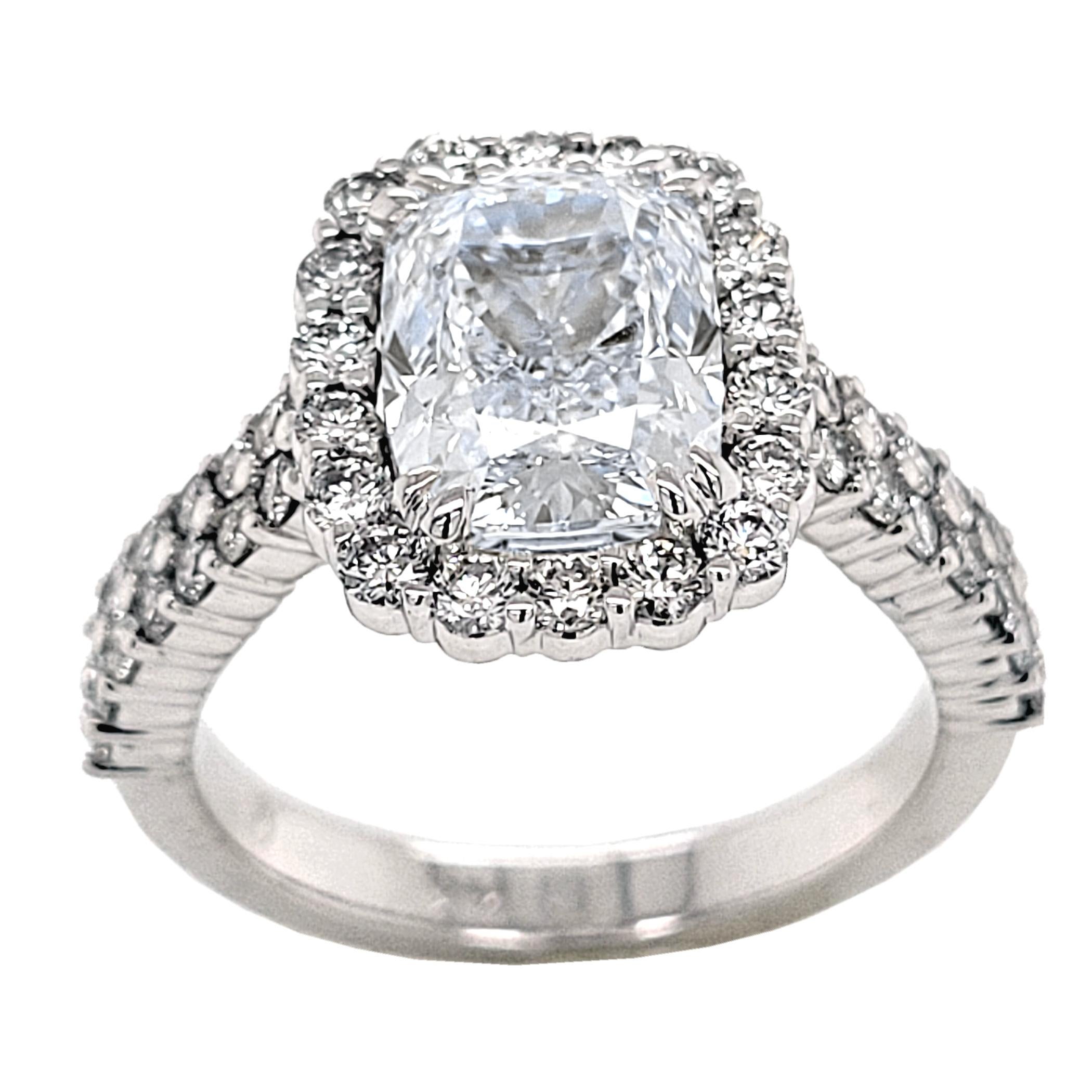 A very fine 3.02 Ct Rectangular Cushion Cut G/VS1 GIA certified center Diamond set in a fine 14k gold Pave set diamonds on the Halo and a double row pave Set on the shank. Total diamond weight of 0.98 Ct. on the side. 

Diamond specs:
Center stone: