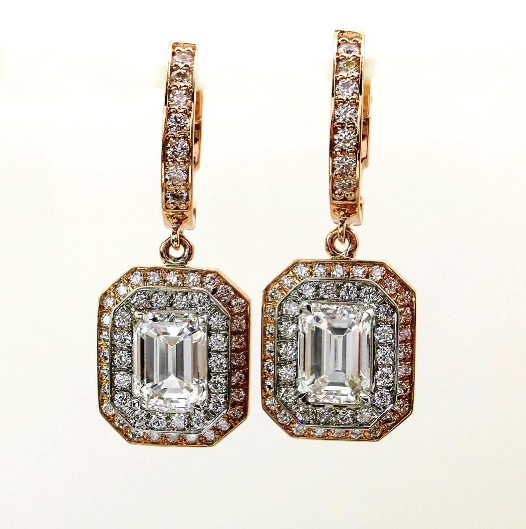 This extraordinary perfectly matched 2 large EMERALD CUT Diamonds GIA certified mounted into magnificent custom drop earrings surrounded with extremely sparkling white diamond double halo pave accent.
Fabulous workmanship, looks great from any