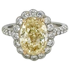 GIA 3.02 Carat Fancy Yellow Oval Diamond Engagement Ring