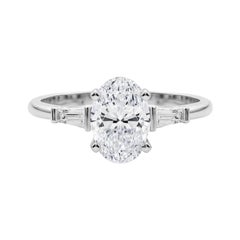 Bague en or blanc GIA 3(three) pierres ovales Baguette fuselée