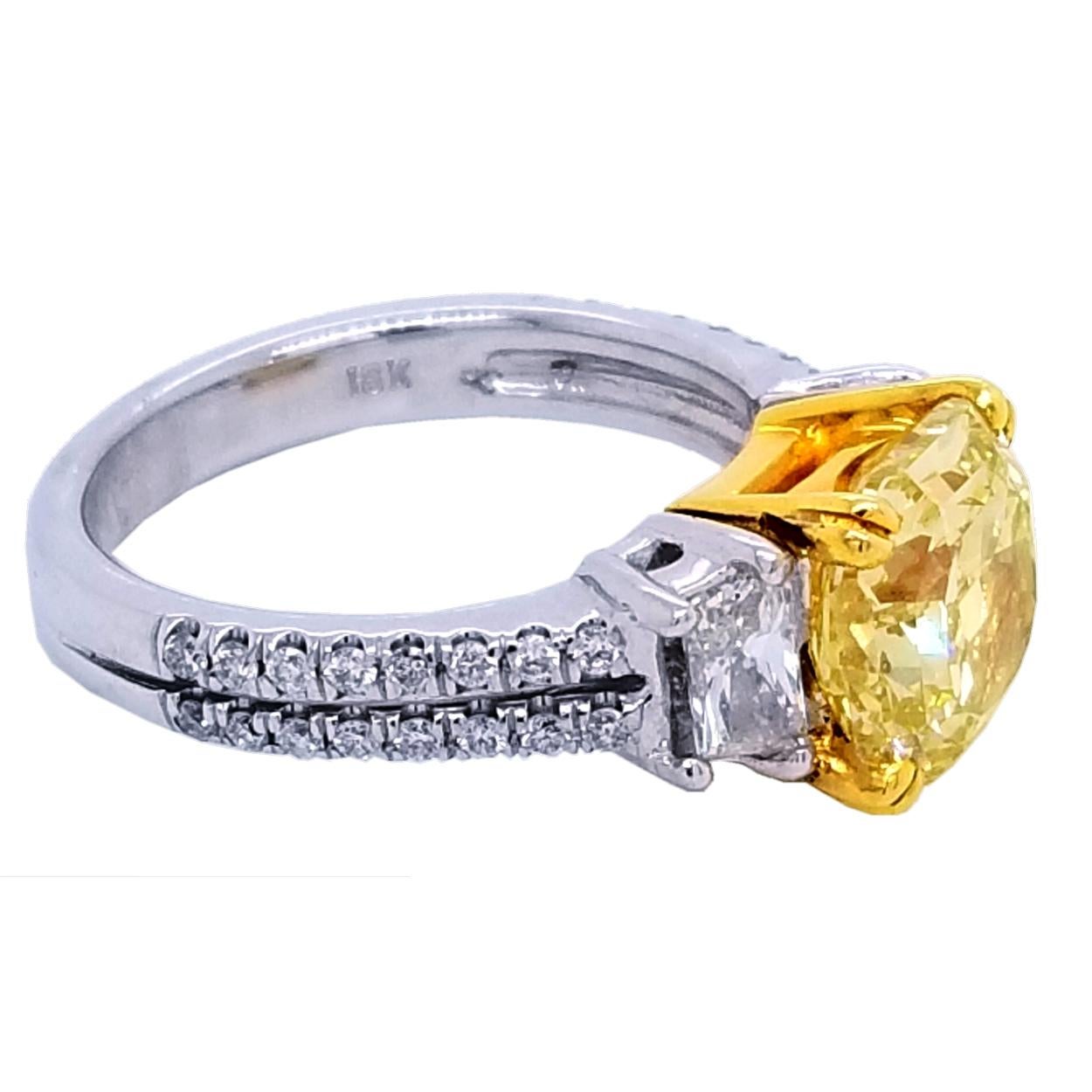 A very fine Radiant Cut Natural Fancy Intense Yellow SI2 GIA certified center Diamond set in a fine 18K gold pave set Ring with 2 Trapezoid diamonds on the side with total weight of 0.8 Ct. #sayitwithyellow #canarydiamond.

Diamond specs:
Center