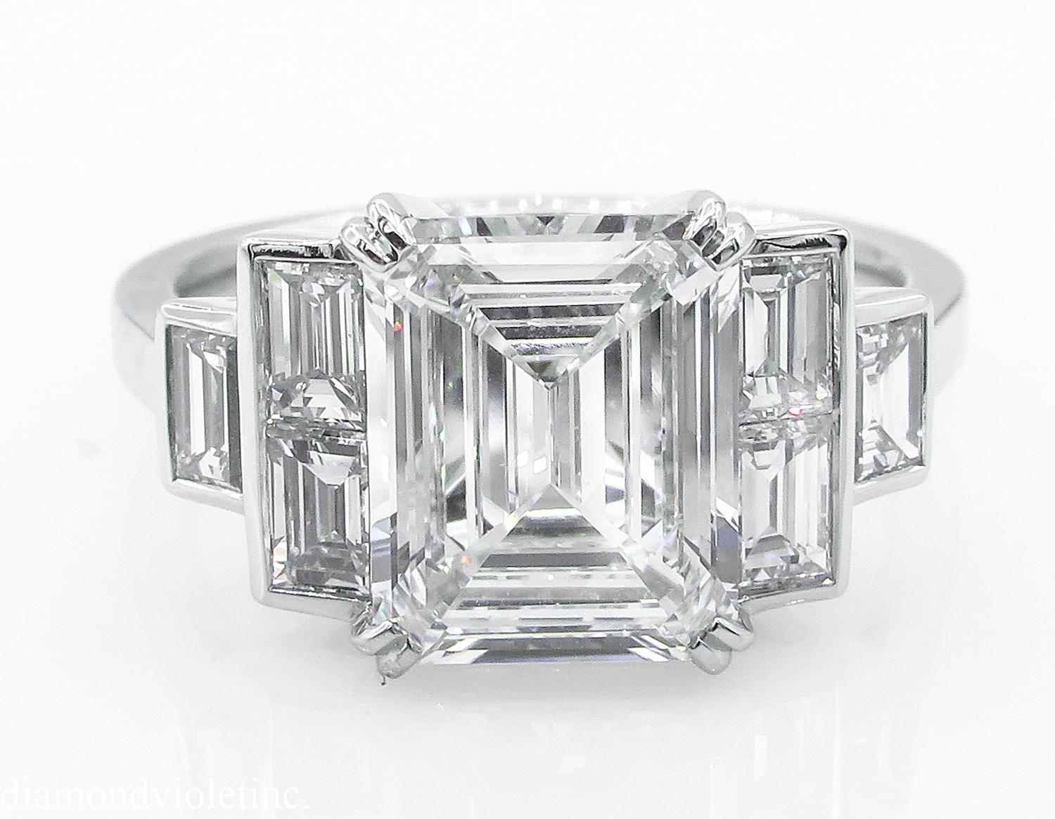 A Timeless Elegant Estate Vintage Diamond Engagement Ring with GIA Certified 2.01ct Emerald cut Center Diamond in E color VS1 clarity (COLORLESS and Very Clean); with measurements of 9.01x7.23x3.51mm; appears much LARGER than its size!! GIA report