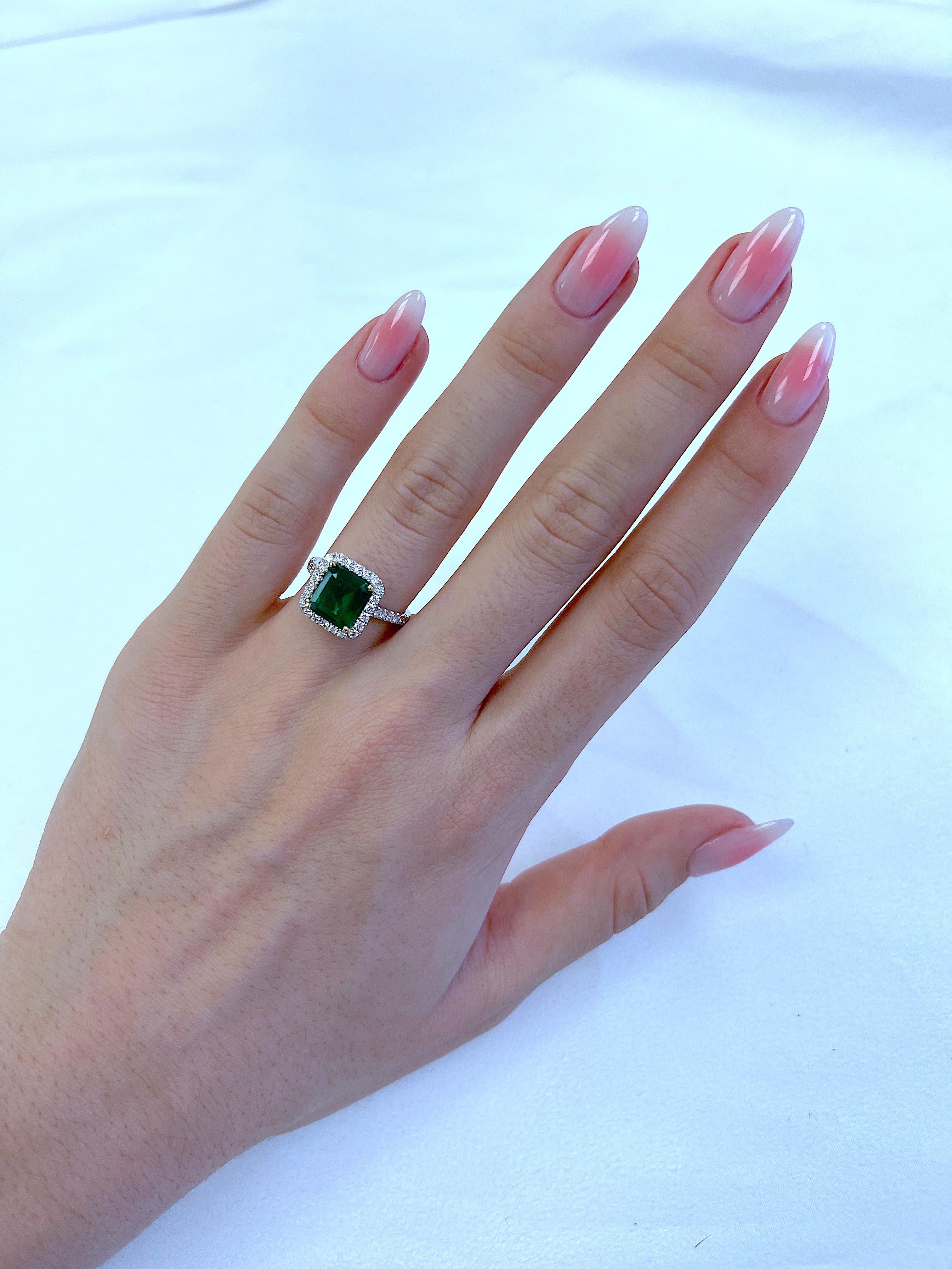 Classic emerald and diamond halo ring, GIA certified. 
3.10 carats total gemstone weight.
2.53 carat emerald cut emerald, F2, GIA certified. Complimented by 36 round brilliant diamonds, 0.57 carats, F/G color and VS clarity. 18k white and yellow