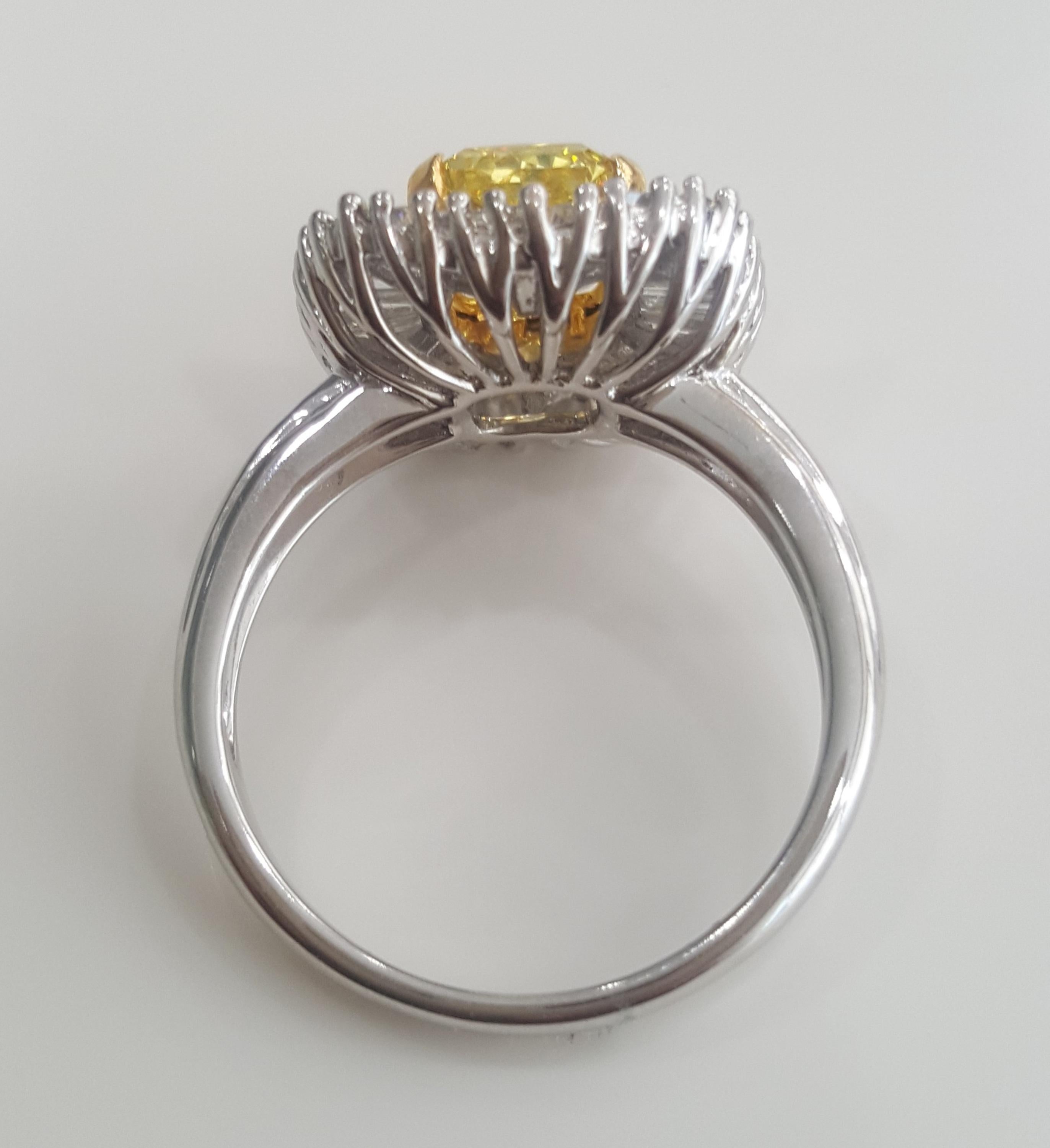 Contemporary GIA 3.12 Carat Natural Fancy Vivid Yellow Radiant And Baguettes Diamond Ring.  For Sale