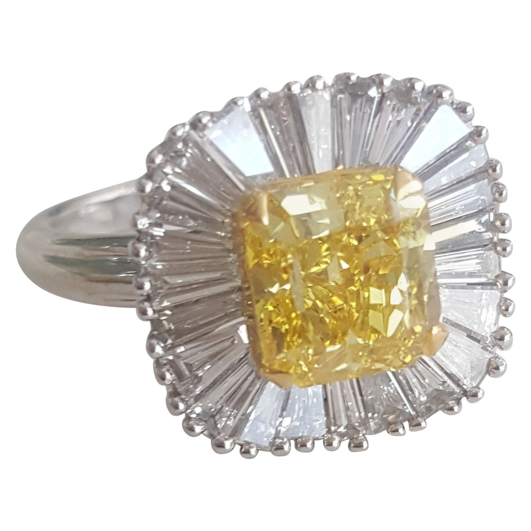 GIA 3.12 Carat Natural Fancy Vivid Yellow Radiant And Baguettes Diamond Ring. 