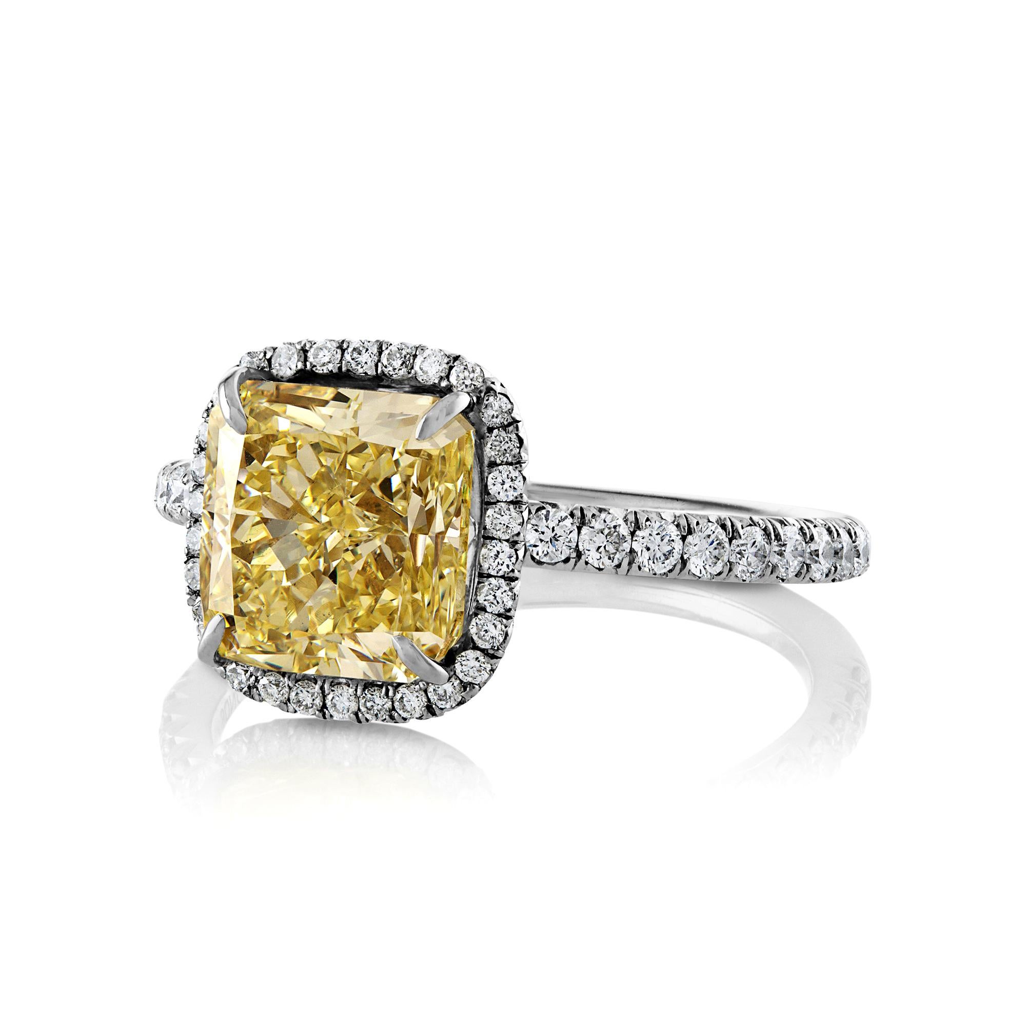 This is ring is just Beautiful! A beams of sunshine radiate day and night from this fabulous dazzler with gorgeous center natural fancy color diamond is ignited by bright white diamonds that shimmer with real sparkle and flair. Exclusive,