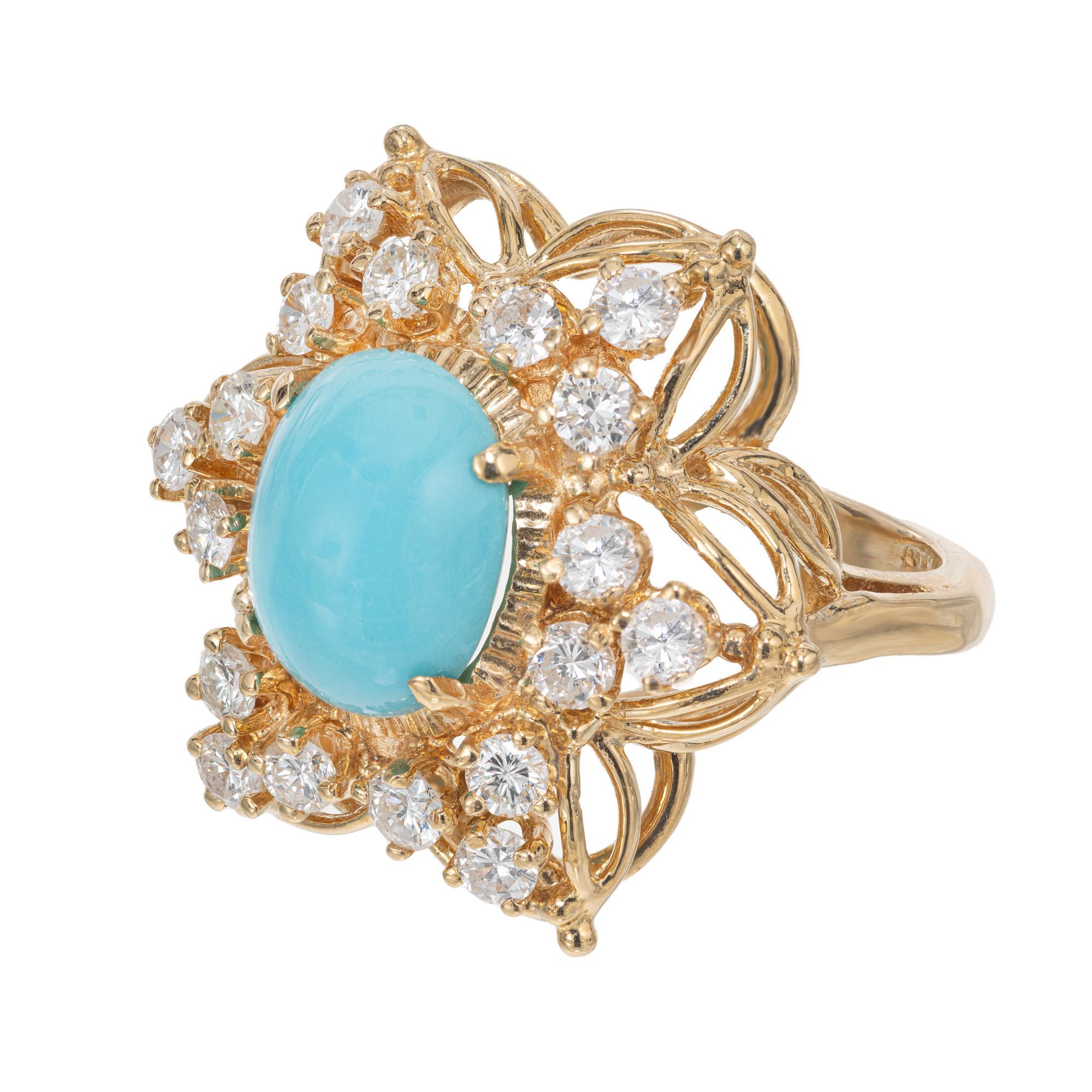 Stunning vintage 1950s Turquoise and diamond cocktail ring. GIA certified cabochon blue 3.25ct turquoise center stone, mounted in a 14k yellow gold cocktail ring setting. With a halo of 18 round cut diamonds totaling 1.17cts. The GIA has certified