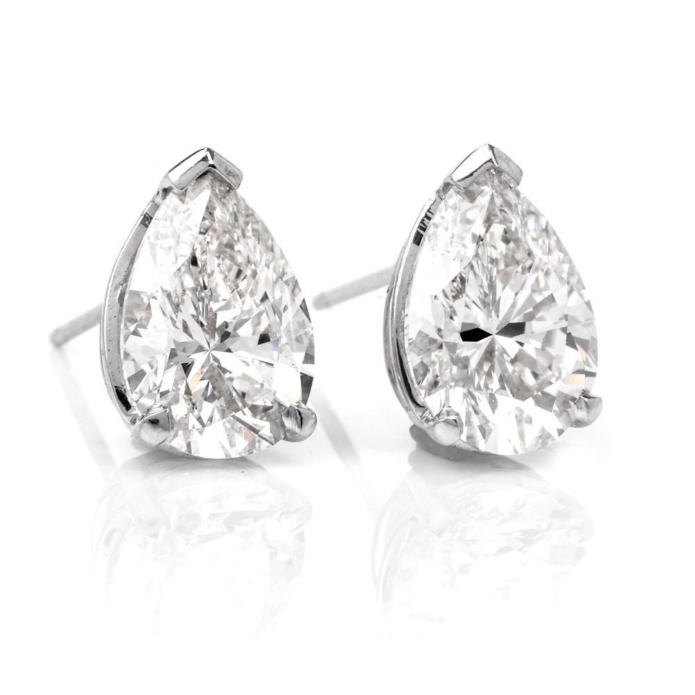 These exquisite diamond stud earrings are crafted in solid platinum. Set with two stunning pear shape natural genuine diamonds, both GIA certified weighing 3.24 carats in total. Both diamonds are GIA certified one 1.71 carats J color, VVS2 clarity.