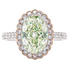 GIA Anillo de oro de 18 quilates con halo de diamante ovalado verde-amarillo fantasía de 3,3 quilates