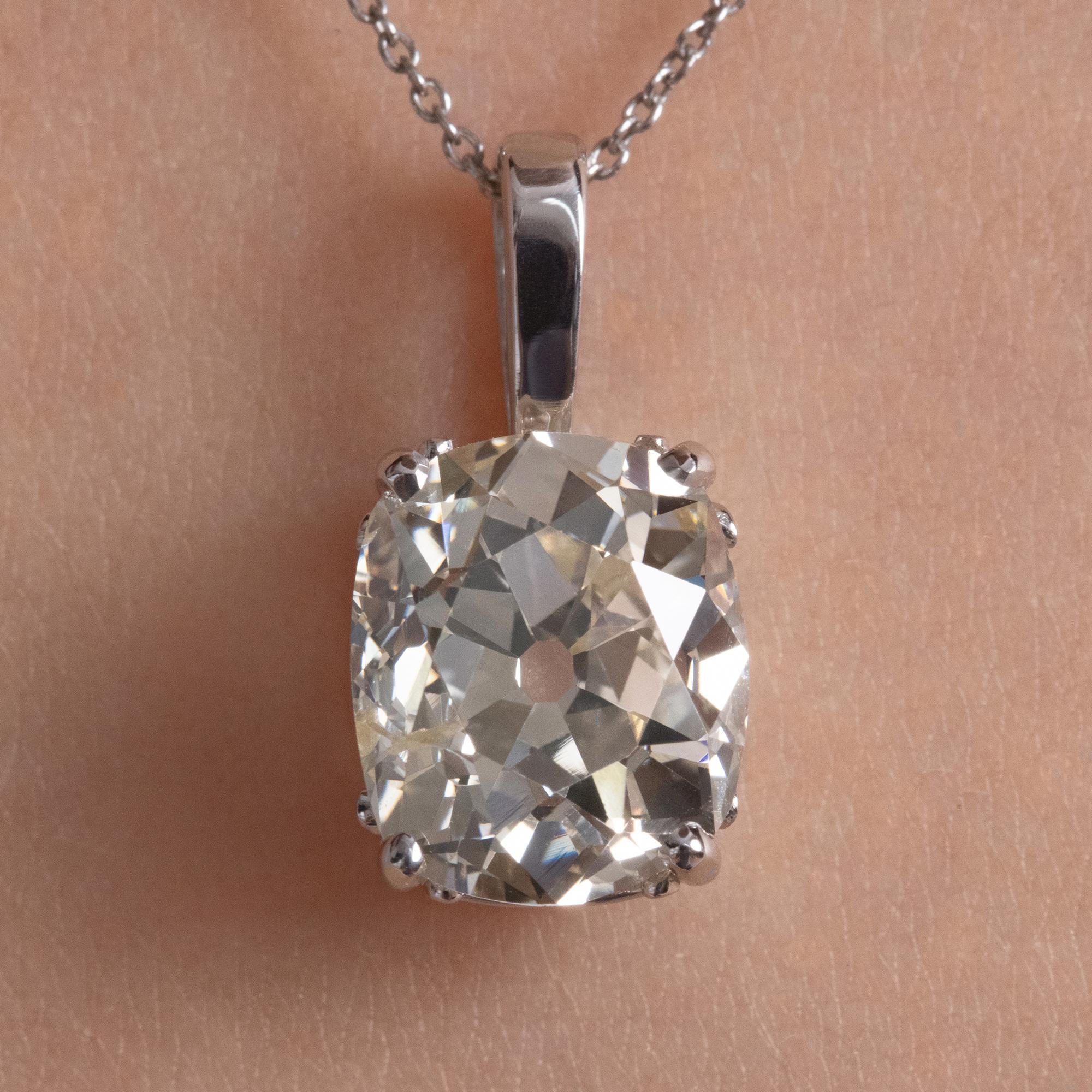 A wonderful Antique Diamond Pendant in 14k White Gold (stamped). GIA Certified 3.32ct Old Mine Cushion Diamond in N color, I1 clarity; with measurements of 9.65x8.10x5.63mm- HUGE! GIA report # 2205859863. 
This Wonderful and Different Diamond