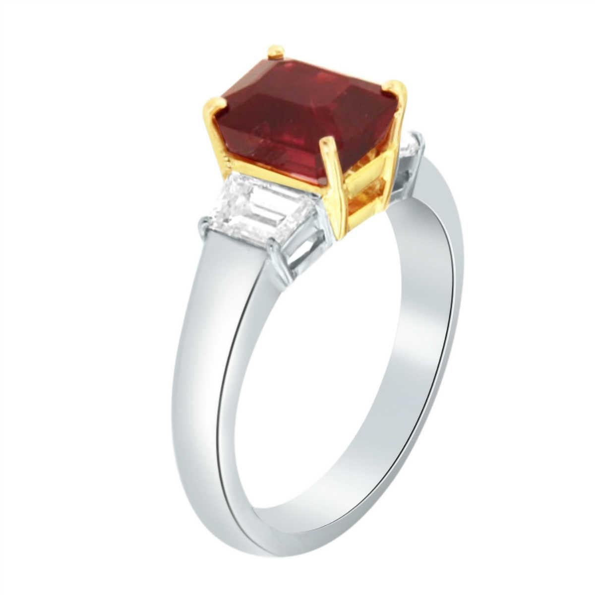 This 18K Two-Tone handcrafted Women's trilogy ring showcases a one-of-a-kind GIA Certified Emerald Cut Ruby accompanied by two (2) Trapezoid Cut diamonds on each side.

Centerstone Weight: 3.36 Carats
Side Diamond Weight: 0.90 Carats
Diamond Color: