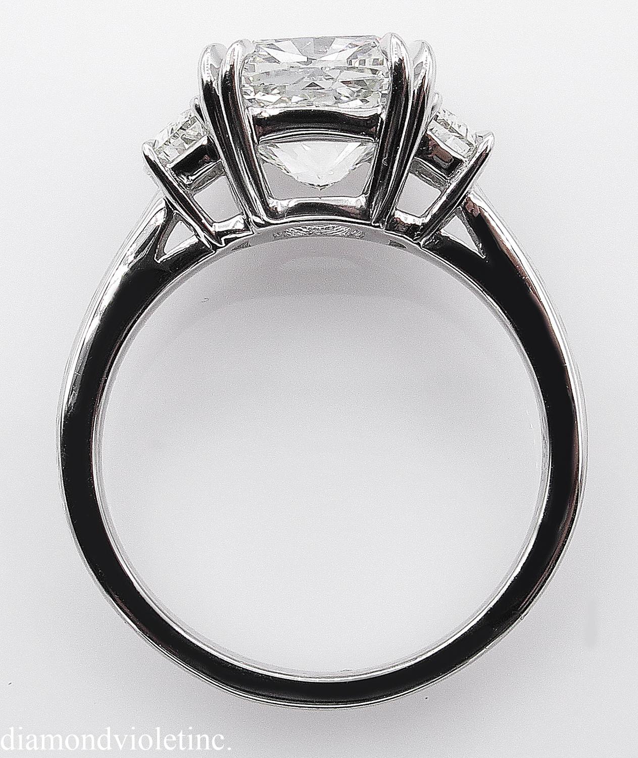 GIA 3.43 Carat Cushion Diamond 3-Stone Engagement Wedding Platinum Ring In Good Condition In New York, NY