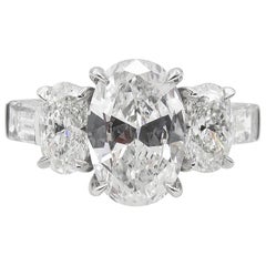 GIA 3.45 Carat Colorless Oval Diamond Three-Stone Engagement Wedding Ring
