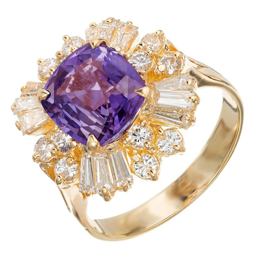 Vintage 1950's Princess style handmade color change sapphire and diamond engagement ring. Set with a beautiful GIA certified 3.45 carat cushion cut sapphire that changes color from violet to purple. A halo of round and baguette diamonds, in a