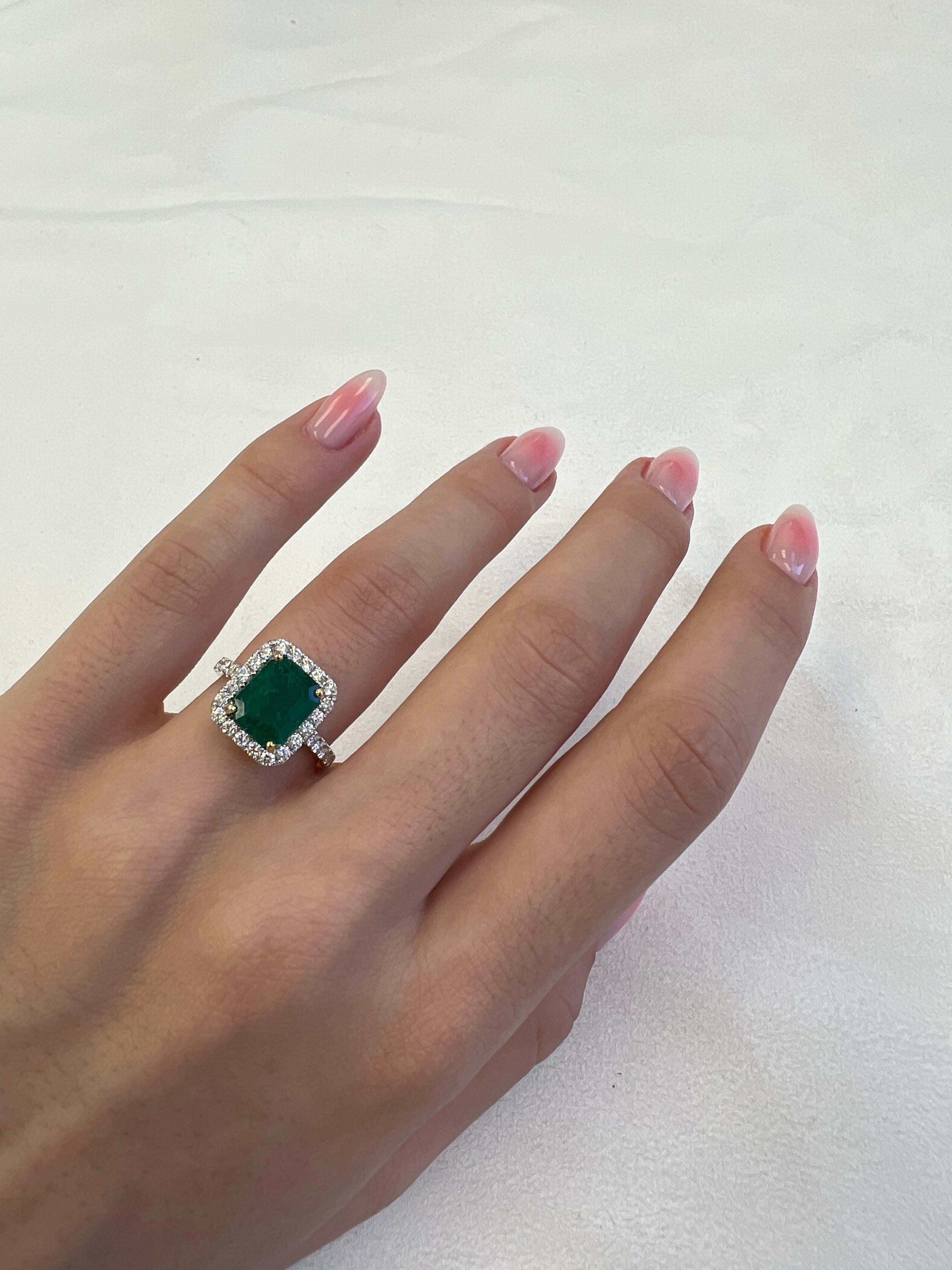 Classic emerald and diamond halo ring, GIA certified. 
3.49 carats total gemstone weight.
2.64 carat emerald cut emerald, F2, GIA certified. Complimented by 32 round brilliant diamonds, 0.85 carats, F/G color and VS clarity. 18k white and yellow