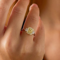 GIA 3.50 carat fancy yellow VVS1 diamond platinum engagement ring