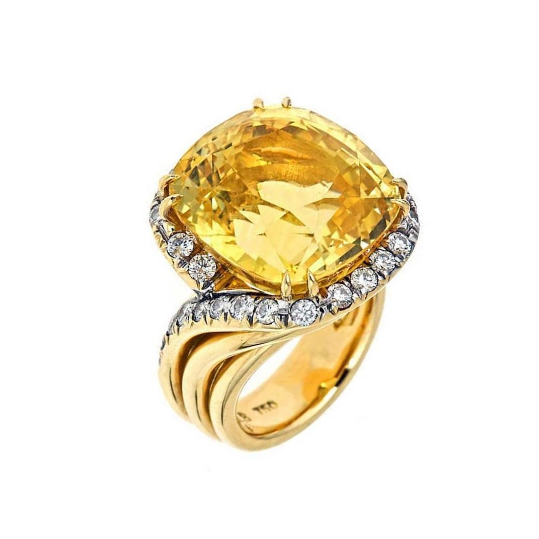 One ring all hand-mounted in 18kt yellow gold with 35.24ct. cushion sapphire. 28 round brilliant cut diamonds. 1.08cts of EF color and VS clarity GIA fine ammo sapphire. 

This piece was made in Manhattan entirely by hand and was cast, one at a