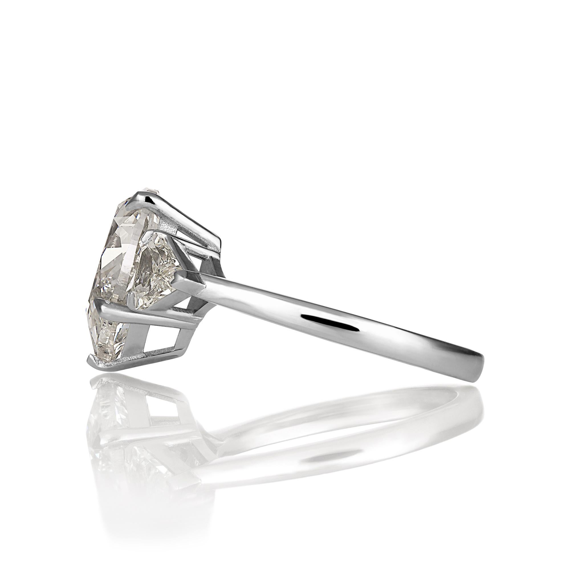 This a Beautiful Estate Vintage Pear Shaped Solitaire Ring with 2 Large Kite Diamonds, 3.62ct in total weight.
The center diamond is 3.01ct, L color, SI2 (warm white and eye clean), GIA CERTIFIED #7386994739.
GREAT CUT and BRILLIANCE! The