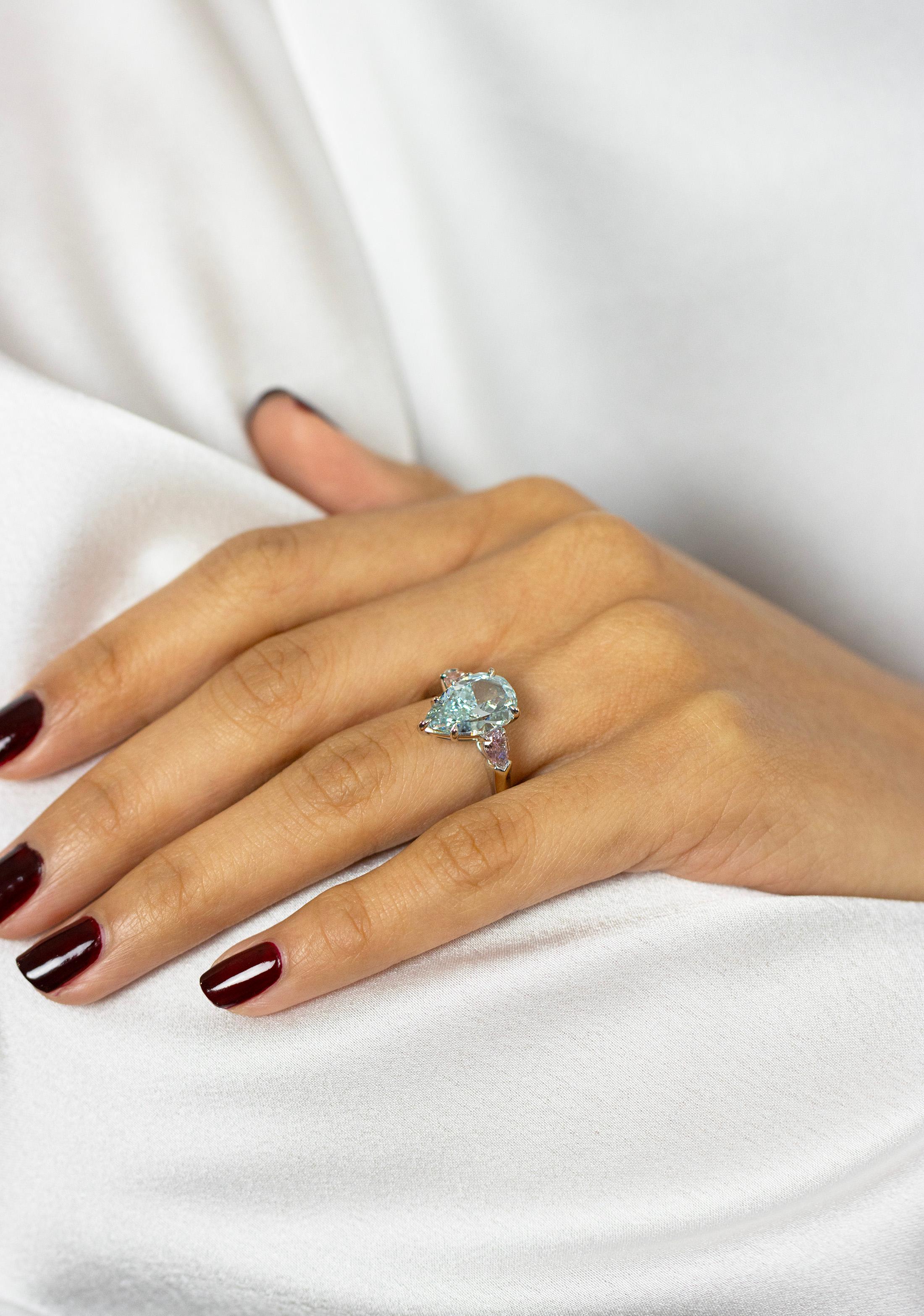 Women's GIA 3.68 Carat Pear Cut Fancy Intense Green-Blue Diamond Three Stone Ring For Sale