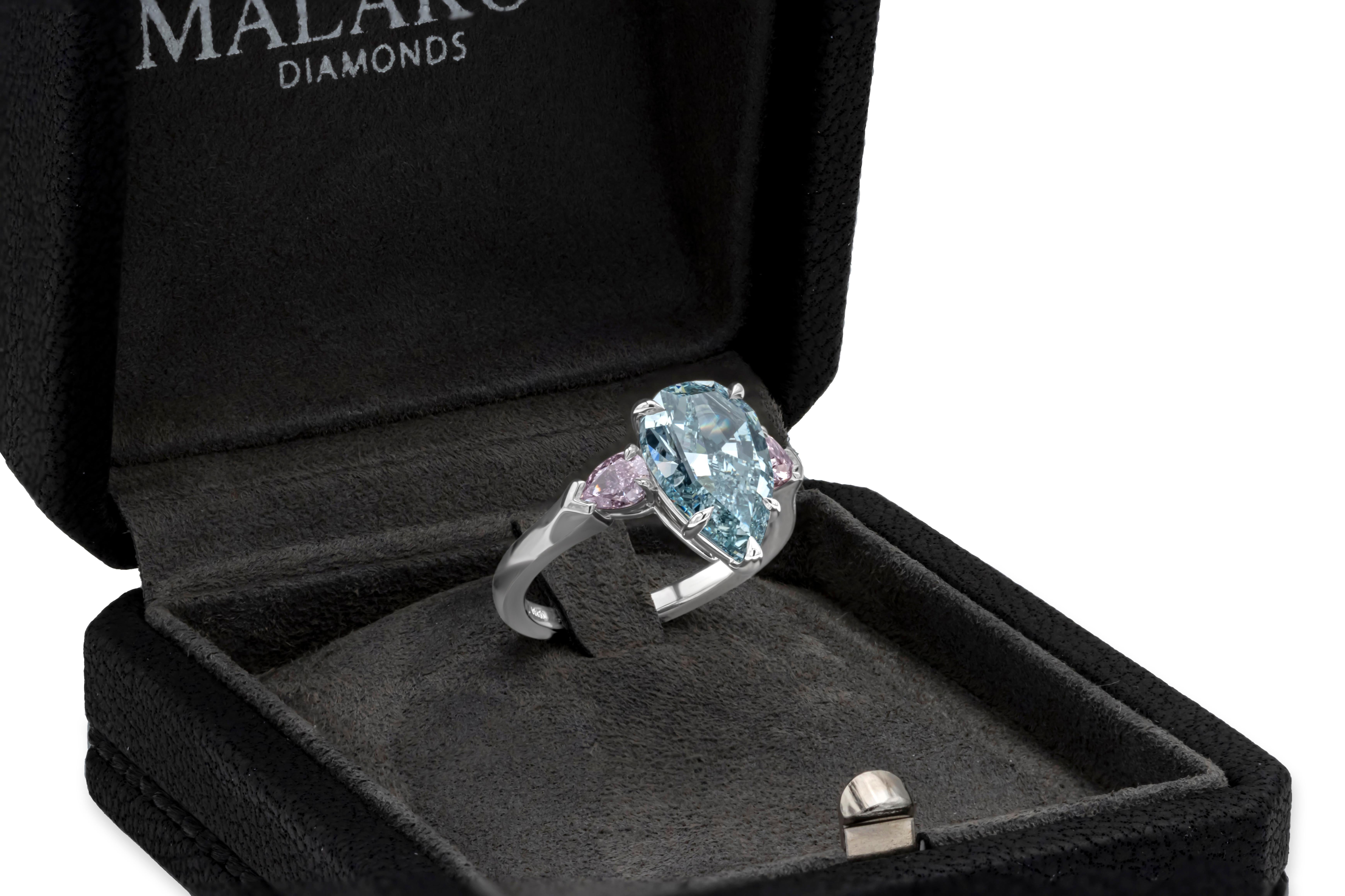 GIA 3.68 Carat Pear Cut Fancy Intense Green-Blue Diamond Three Stone Ring In New Condition For Sale In New York, NY