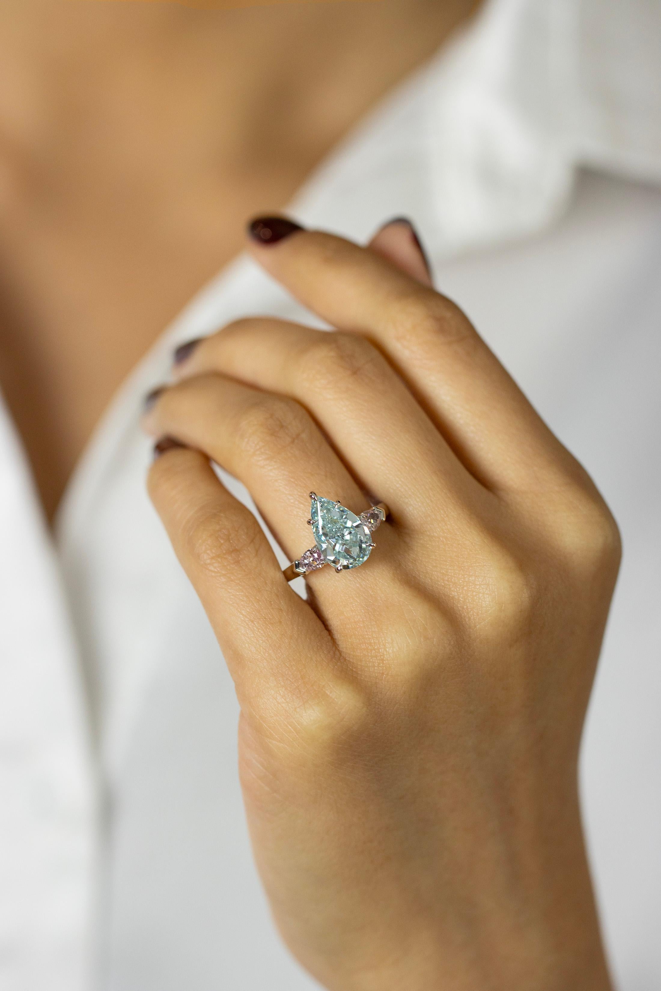 GIA 3.68 Carat Pear Cut Fancy Intense Green-Blue Diamond Three Stone Ring For Sale 3