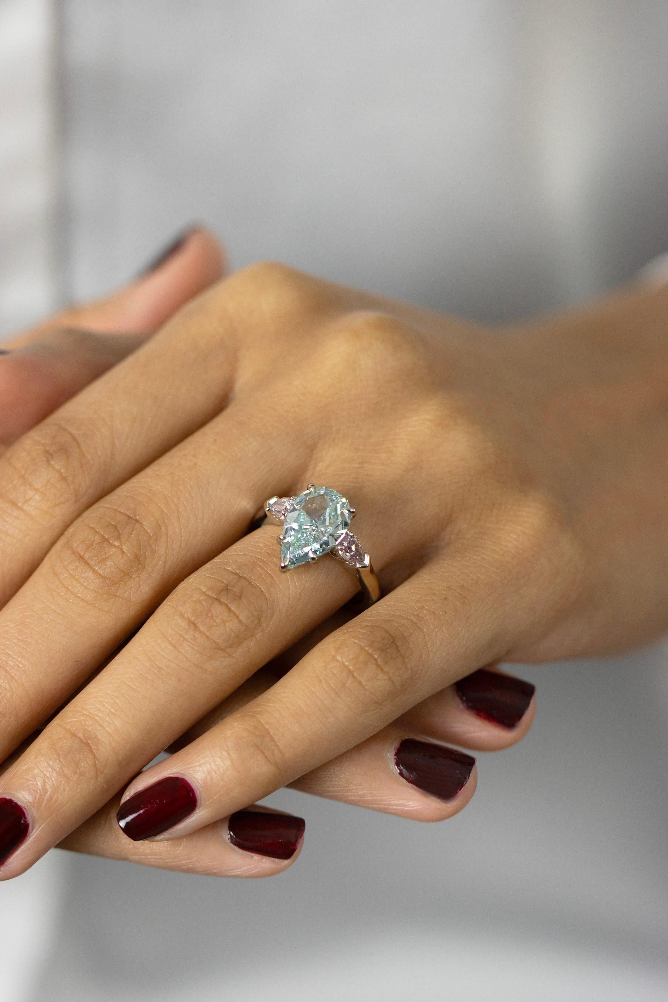 GIA 3.68 Carat Pear Cut Fancy Intense Green-Blue Diamond Three Stone Ring For Sale 4