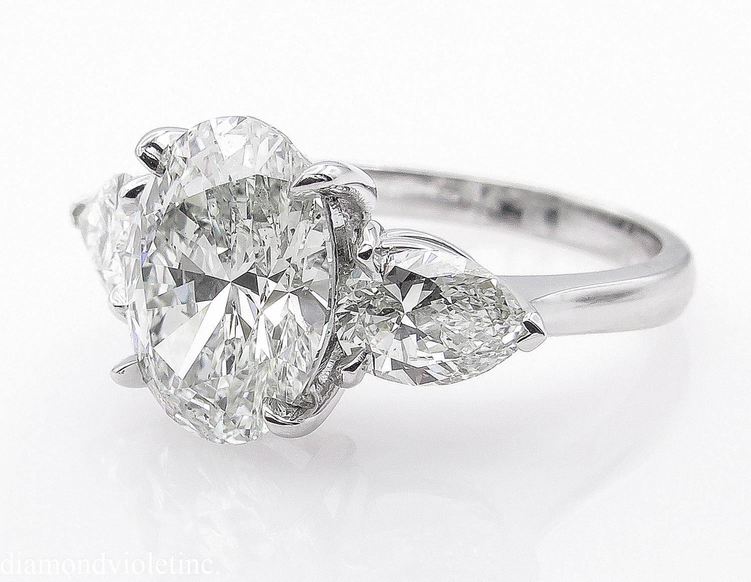 Oval Cut GIA 3.70 Carat Vintage Oval Diamond Three-Stone Engagement Wedding Platinum Ring