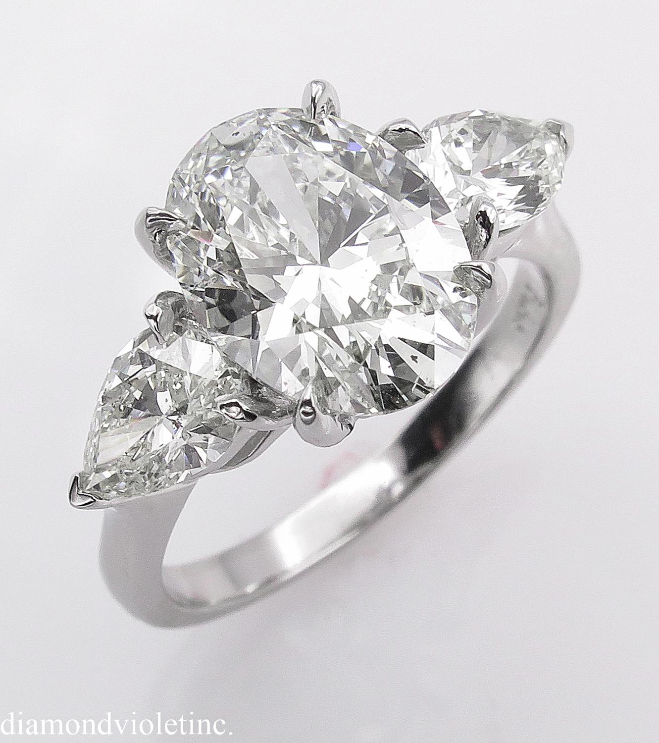 GIA 3.70 Carat Vintage Oval Diamond Three-Stone Engagement Wedding Platinum Ring In Good Condition In New York, NY