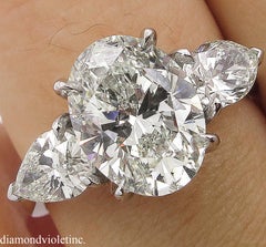 GIA 3.70 Carat Vintage Oval Diamond Three-Stone Engagement Wedding Platinum Ring