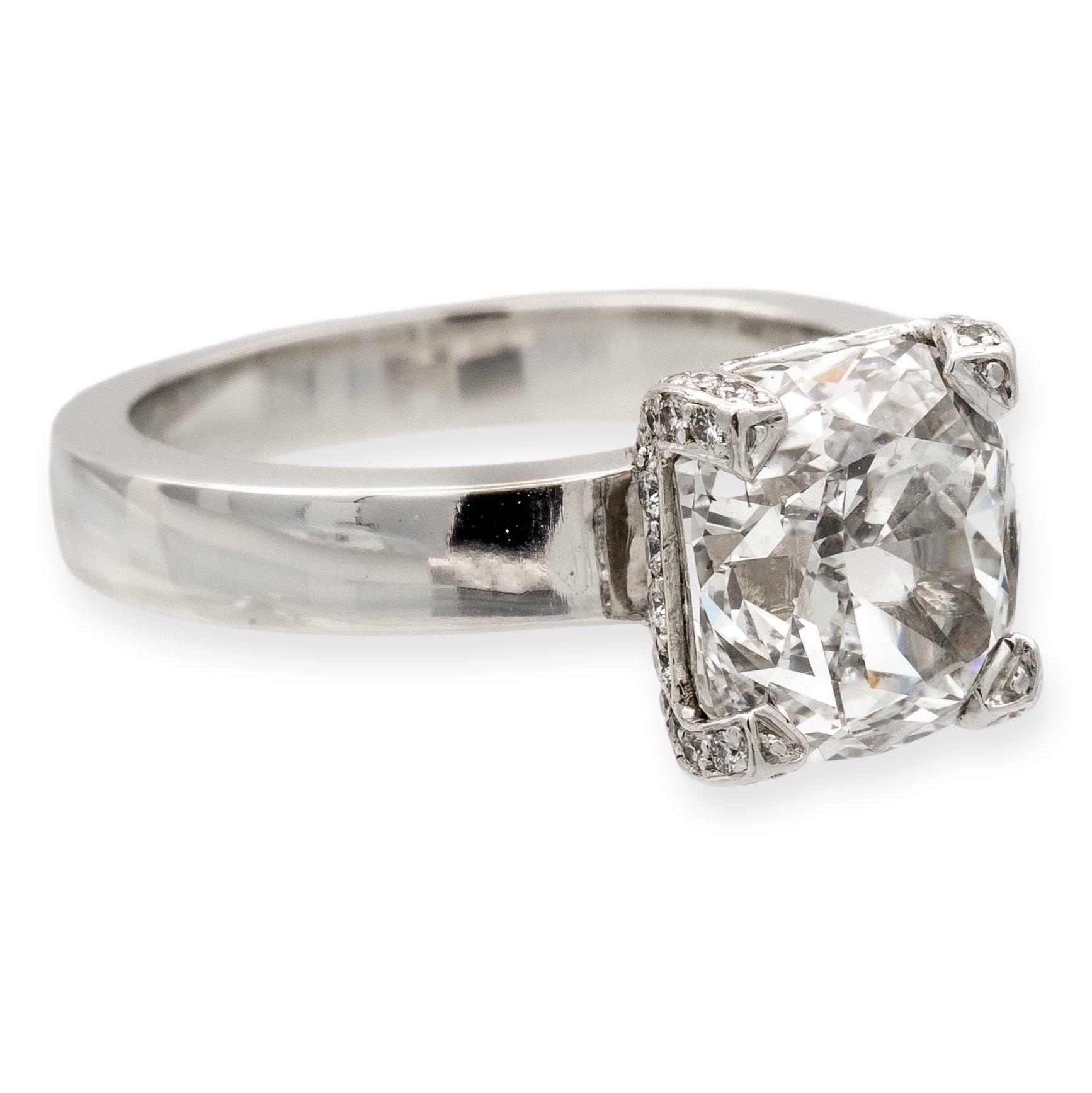 Solitaire diamond engagement ring featuring a Cushion brilliant cut diamond center weighing 3.72 carats G color and VS2 clarity certified by the GIA (Gemological Institute of America) adorned with a hidden halo of pave set round brilliant cut
