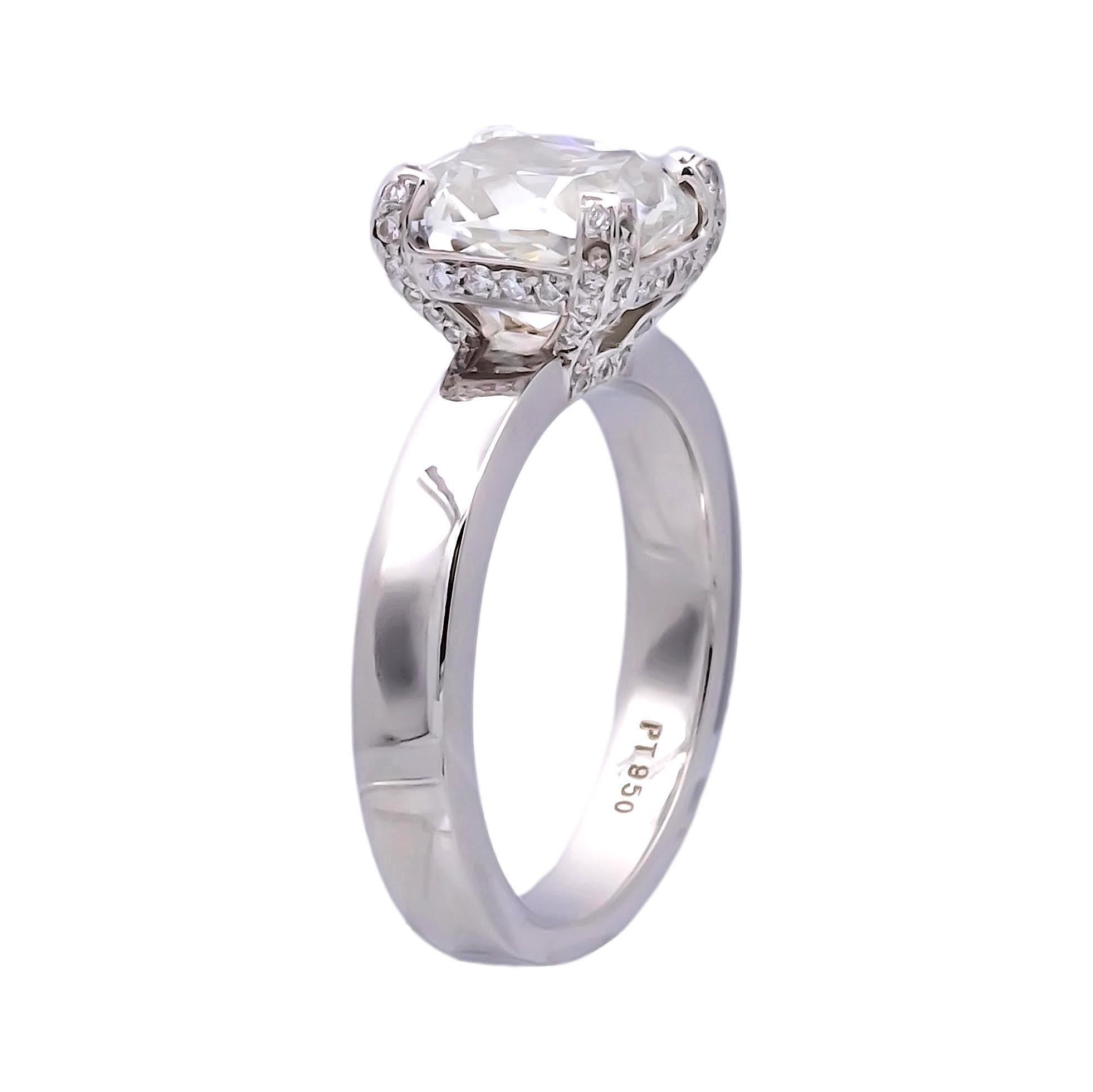 Solitaire diamond engagement ring featuring a Cushion brilliant cut diamond center weighing 3.72 carats G color and VS2 clarity certified by the GIA (Gemological Institute of America) adorned with a hidden halo of pave set round brilliant cut