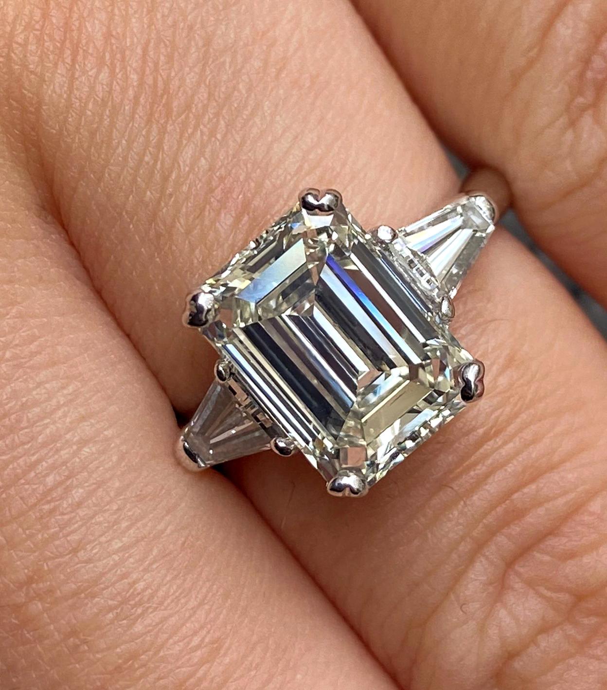 GIA 3.75ctw Estate Vintage Emerald Cut Diamond 3Stone Engagement Wedding Ring WG Plus 2 loose trapezoid cut diamonds.
There is nothing more ELEGANT and CLASSIC than a Three-Stone Diamond ring with an EMERALD cut Diamond!
The total Diamond Weight is