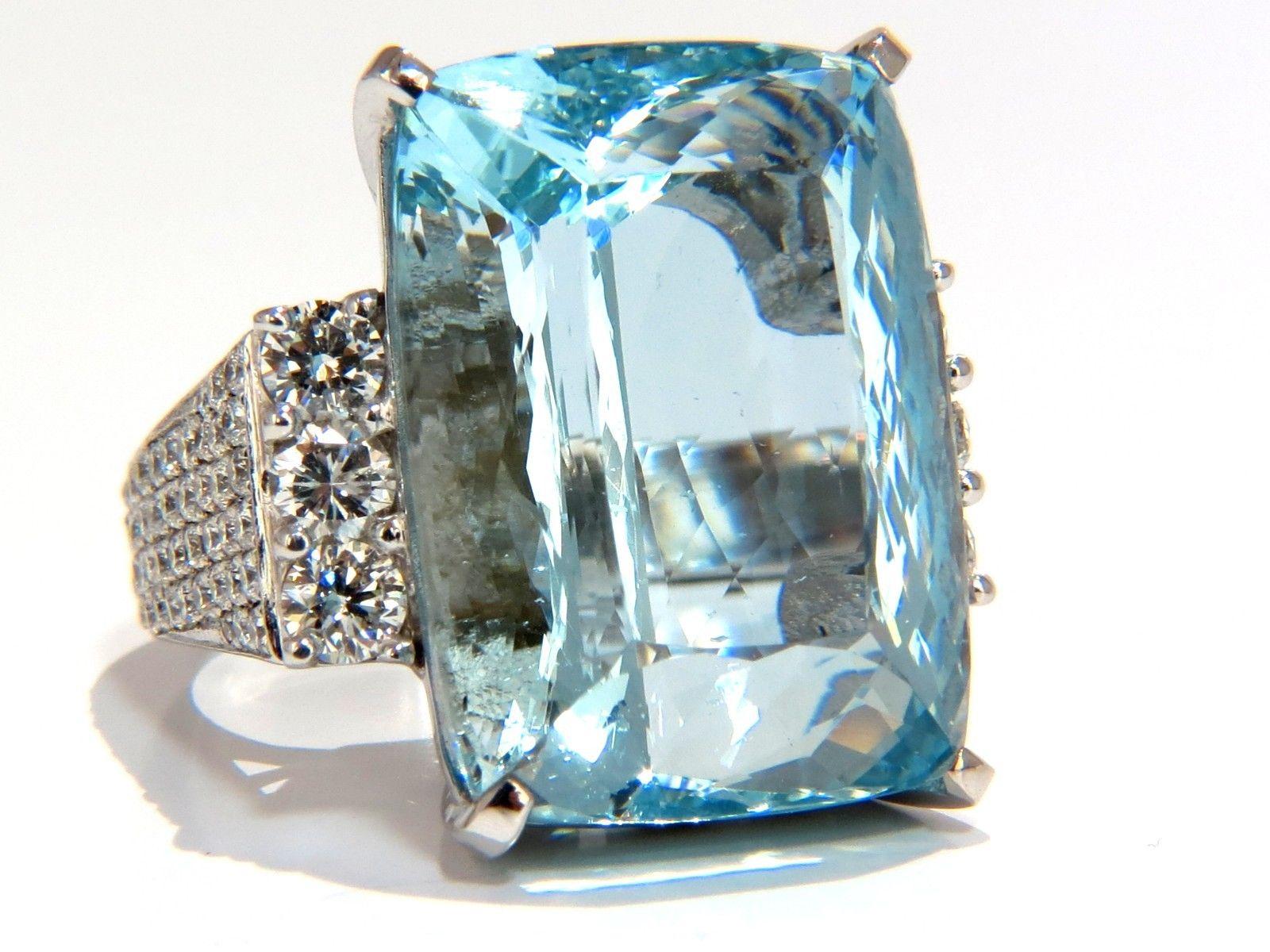 Cushion Cut Aquamarine

GIA Certified 36.10ct. Natural Aquamarine ring.

Cushion cut, clean clarity & Transparent.

Classic Aqua Blue Color

 Clean clarity.

23.75 X 17.96 X 12.46mm



3.00ct Side round diamonds 

G-color Vs-2 clarity.

14kt. white