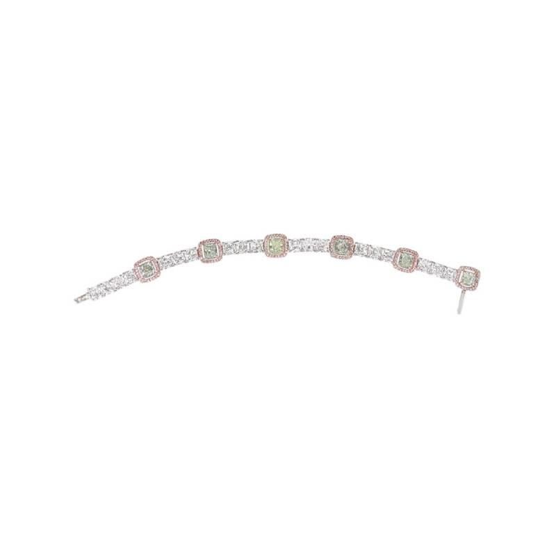 An exquisite diamond line bracelet showcasing six GIA-certified fancy green diamonds, totaling 3.98 carats. These radiant-cut diamonds span from Fancy Light Yellow-Green to Fancy Green, with a clarity range of SI1-SI2. Each green diamond is