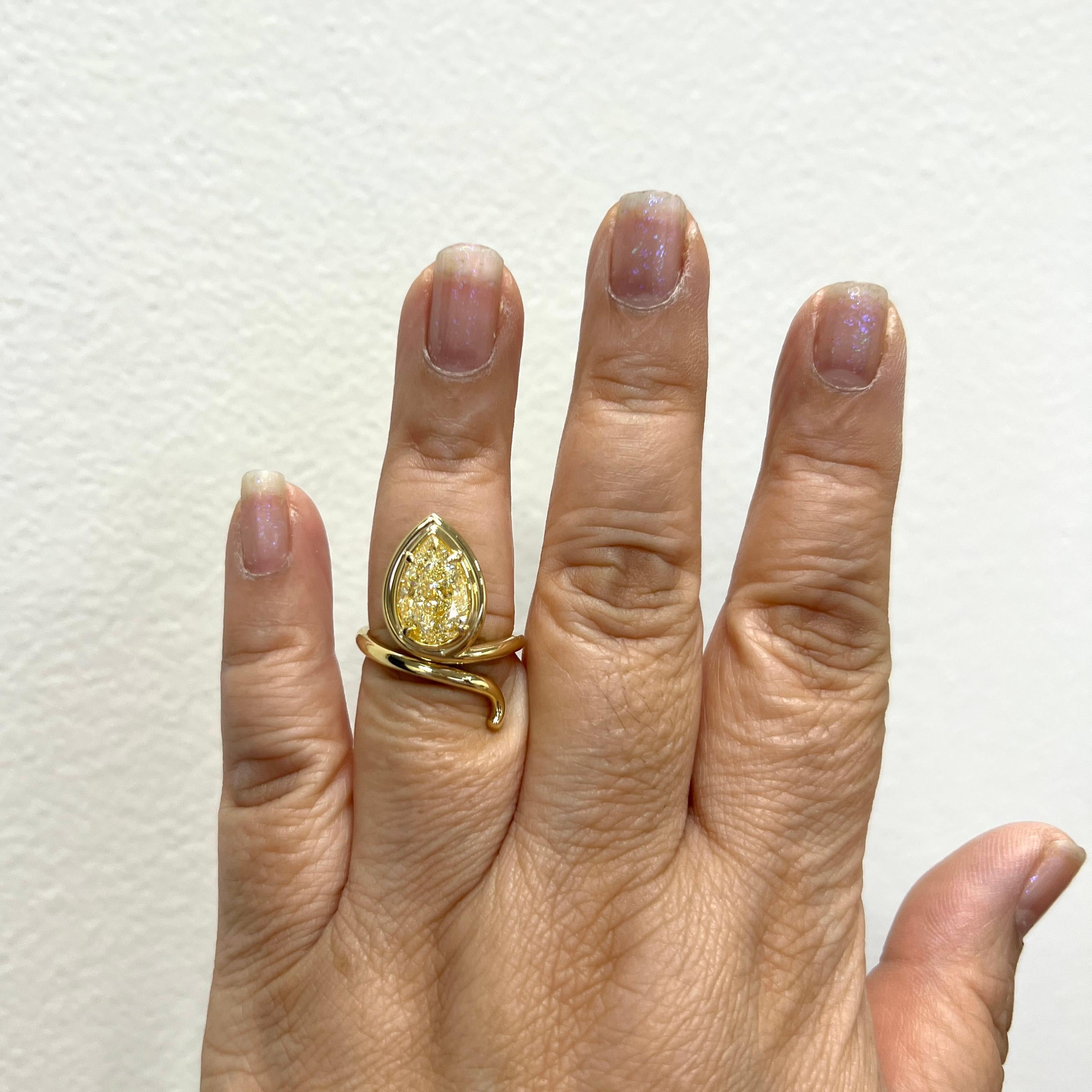 Stunning 4.01 ct. W to X VS2 yellow diamond pear shape.  Ring size 6.75.  Handmade in 18k yellow gold in the USA.  Comes with GIA certificate.