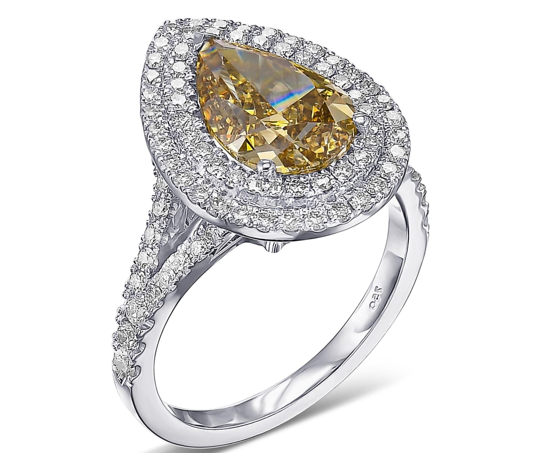 Today we are offering this amazing ring featuring a center 3.21 carat fancy deep brownish greenish yellow pear shape diamond diamonds halo ring. 

A once in a lifetime opportunity to become the proud owner of this amazing ring. The ring has
