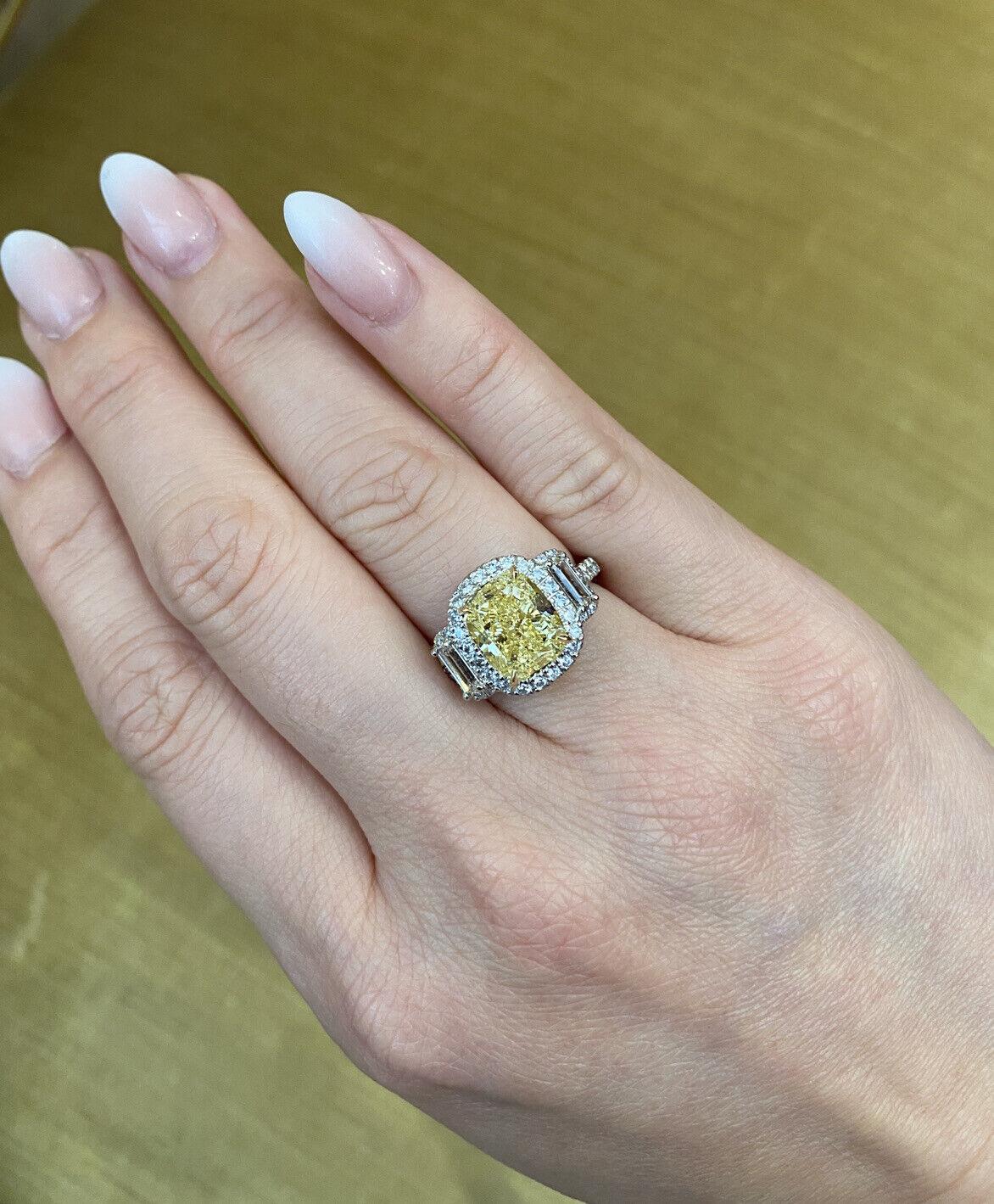 Custom made
Fancy Yellow Diamond Ring
in Platinum & 18k Yellow Gold

features
Center Fancy Yellow Diamond
Cushion Modified Brilliant
weighing 4.02 carats
VS1 clarity
GIA certified

Surrounded by
52 Round Brilliant Diamonds weighing .77 carat
and 2