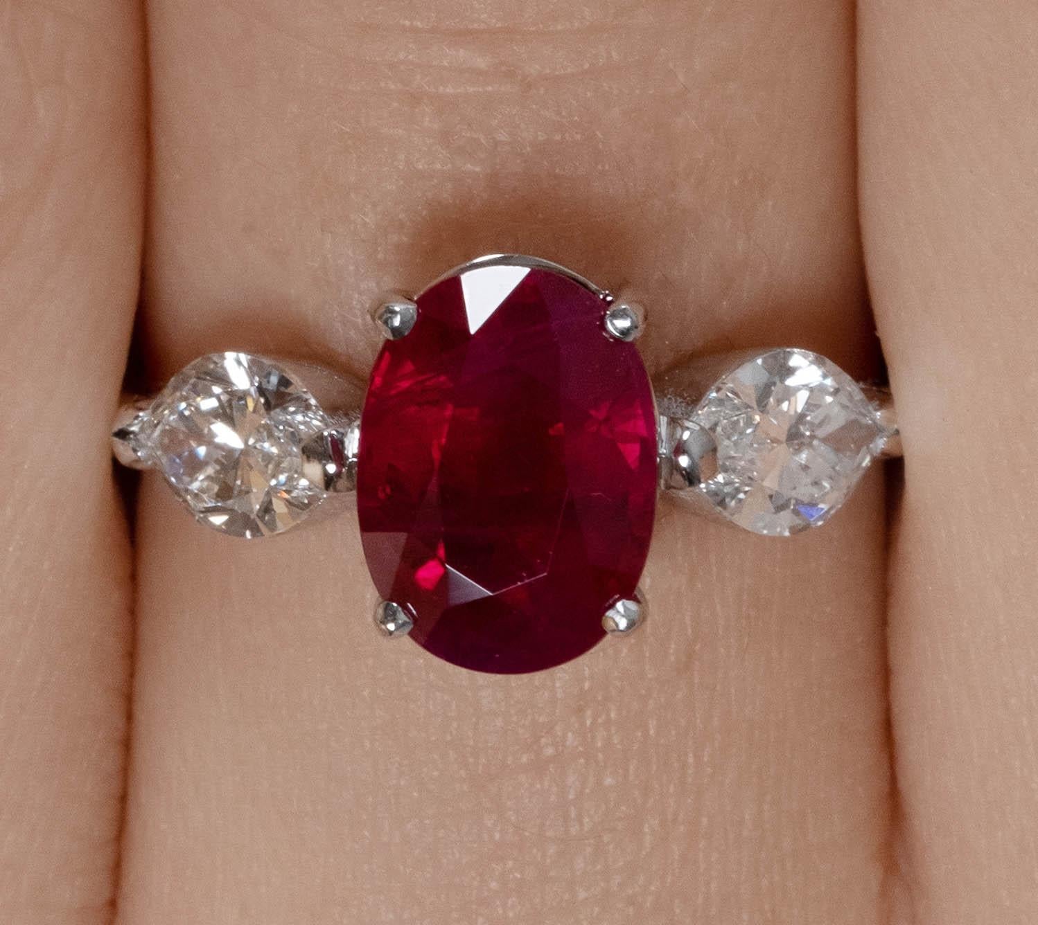 A Breathtaking Estate HANDMADE 18k White Gold (stamped) Three-Stone Engagement ring contains GIA Certified 3.02ct Oval shaped Natural Red Ruby; with measurements of 9.23x6.78x5.27mm. BURMA origin. GIA report # 5211807626. Also available with GRS