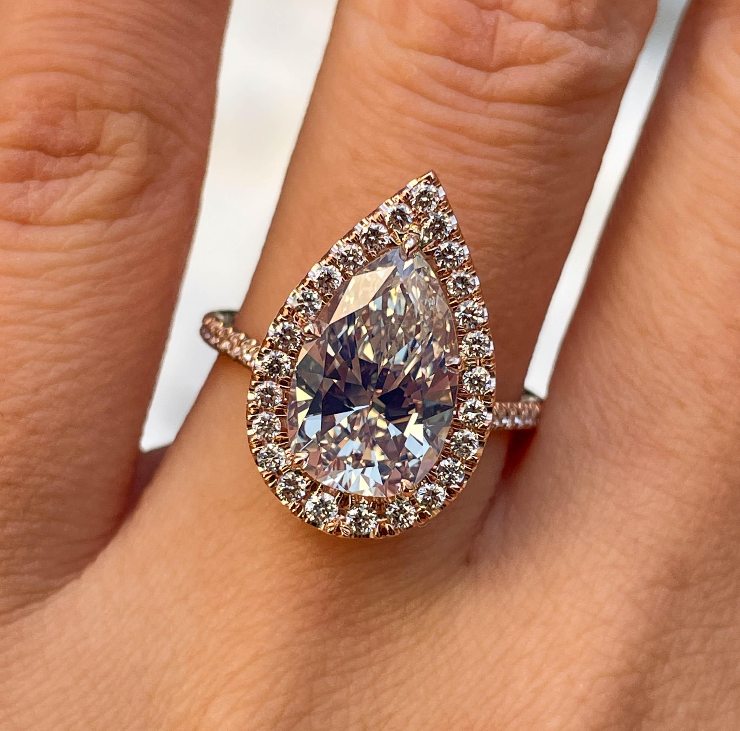 A Beautiful and Elegant GIA Certified Pear Diamond Ring with 3.07ct Center Diamond in M color SI1 clarity (Eye CLEAR). There is nothing more Sparkly and Brilliant in Nature! The measurements of the Center Stone are 12.58x8.09x4.97mm. GIA report: