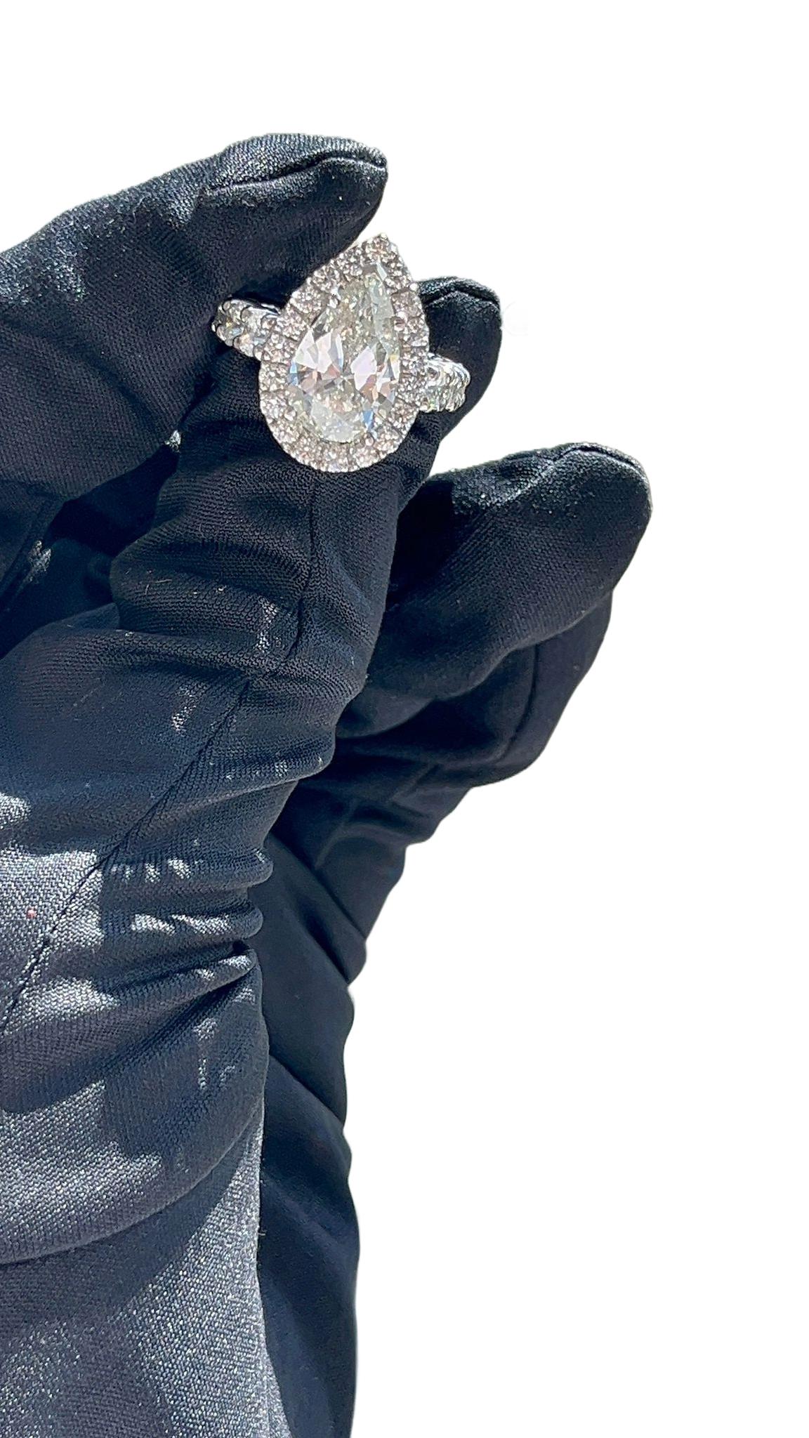 GIA Anello con diamanti a forma di pera da 4,02 carati Diamanti rotondi da 3,50 carati Fascia di eternità in oro 14K in vendita 8