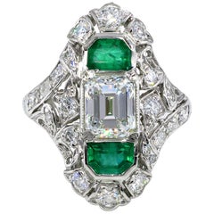 Antique GIA 4.0 Carat Emerald Cut Diamond and Green Emeralds Platinum Art Nouveau Ring