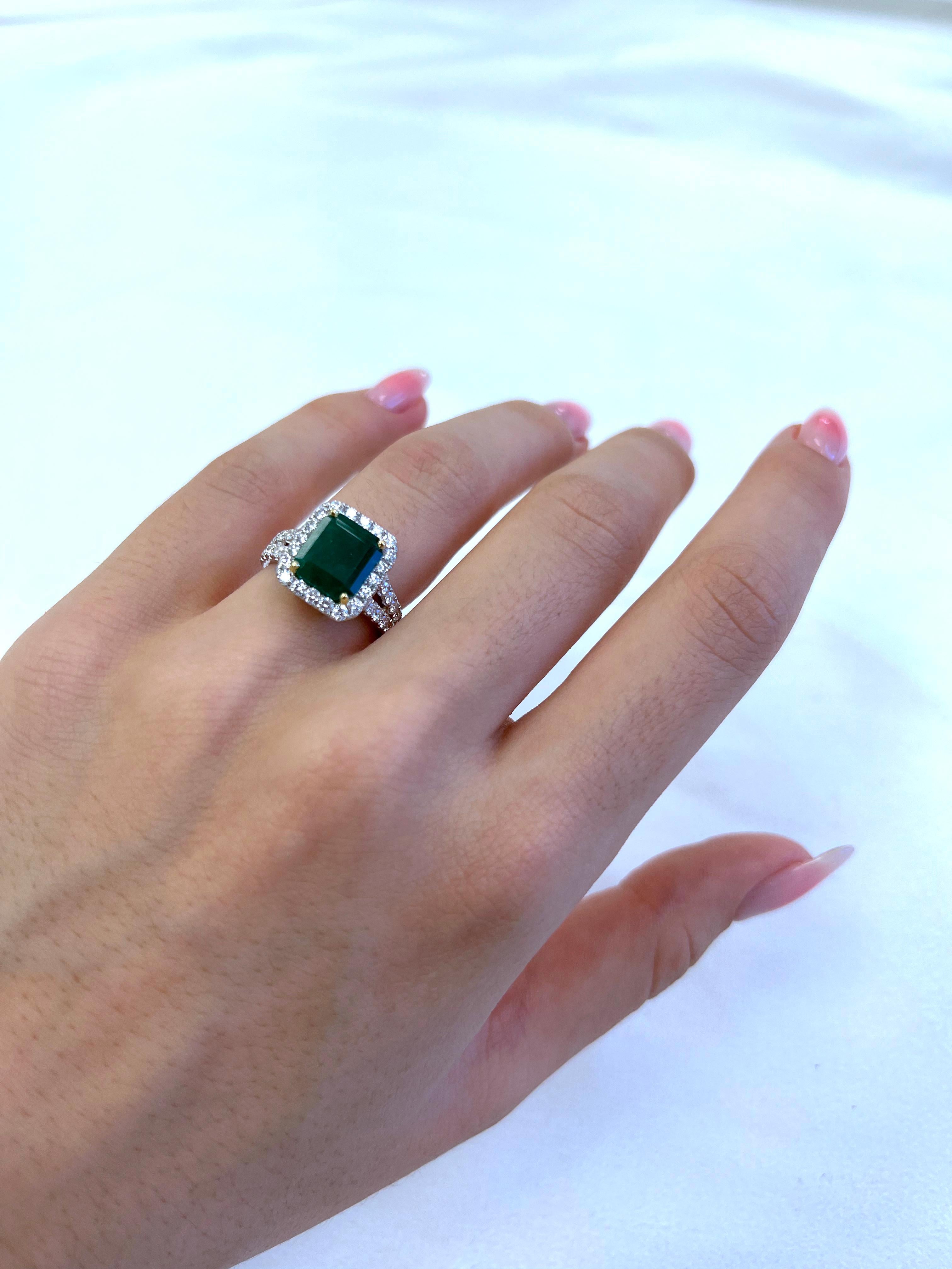 Classic emerald and diamond halo ring, GIA certified. 
4.15 carats total gemstone weight.
2.86 carat emerald cut emerald, F3, GIA certified. Complimented by 44 round brilliant diamonds, 1.23 carats, F/G color and VS clarity. 18k white and yellow