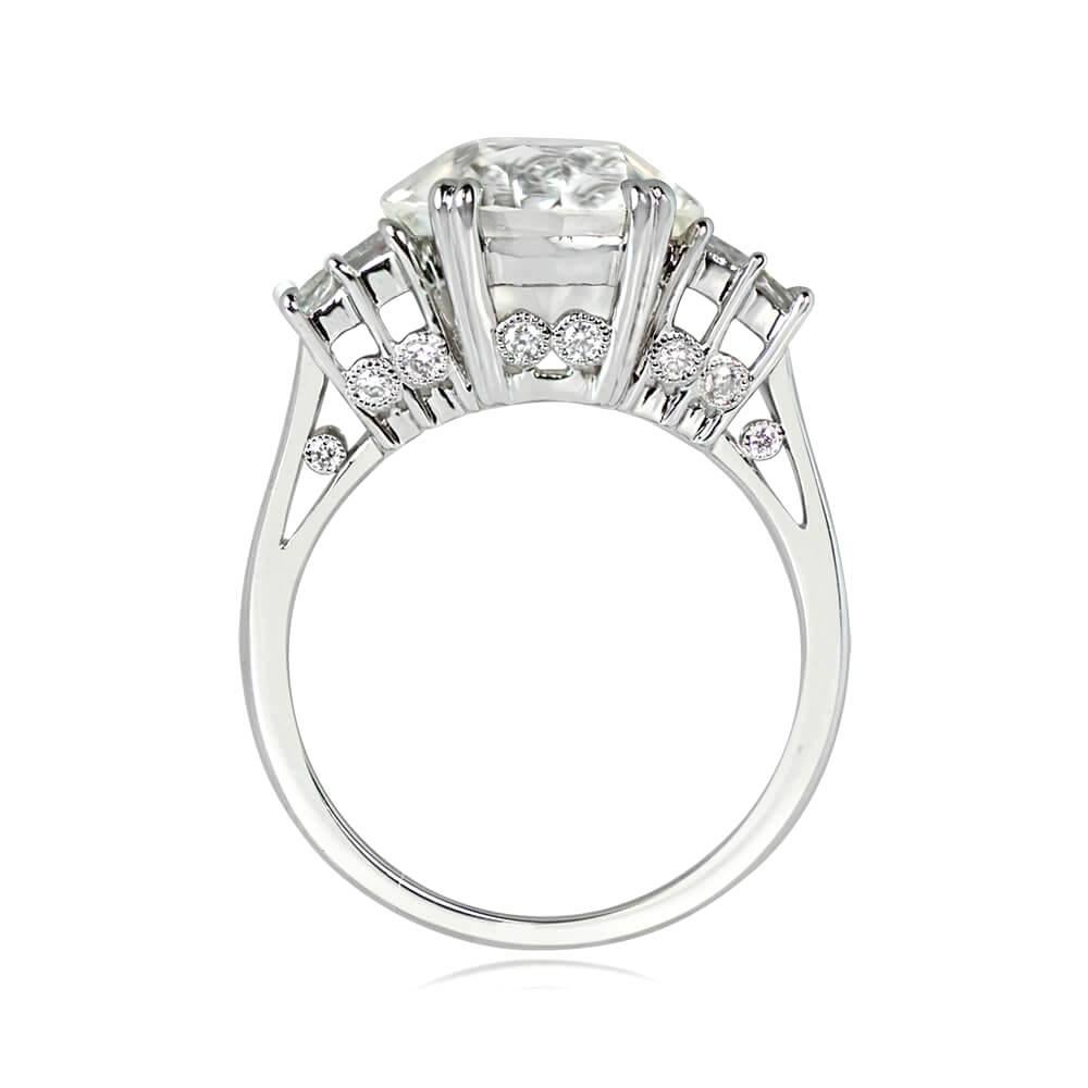 This is a stunning geometric engagement ring with GIA-certified 4.26 carat old European cut diamond (K color, VS1 clarity), prong-set with baguette cut diamond accents on the shoulders. Bezel-set round brilliant cut diamonds adorn the under-gallery,