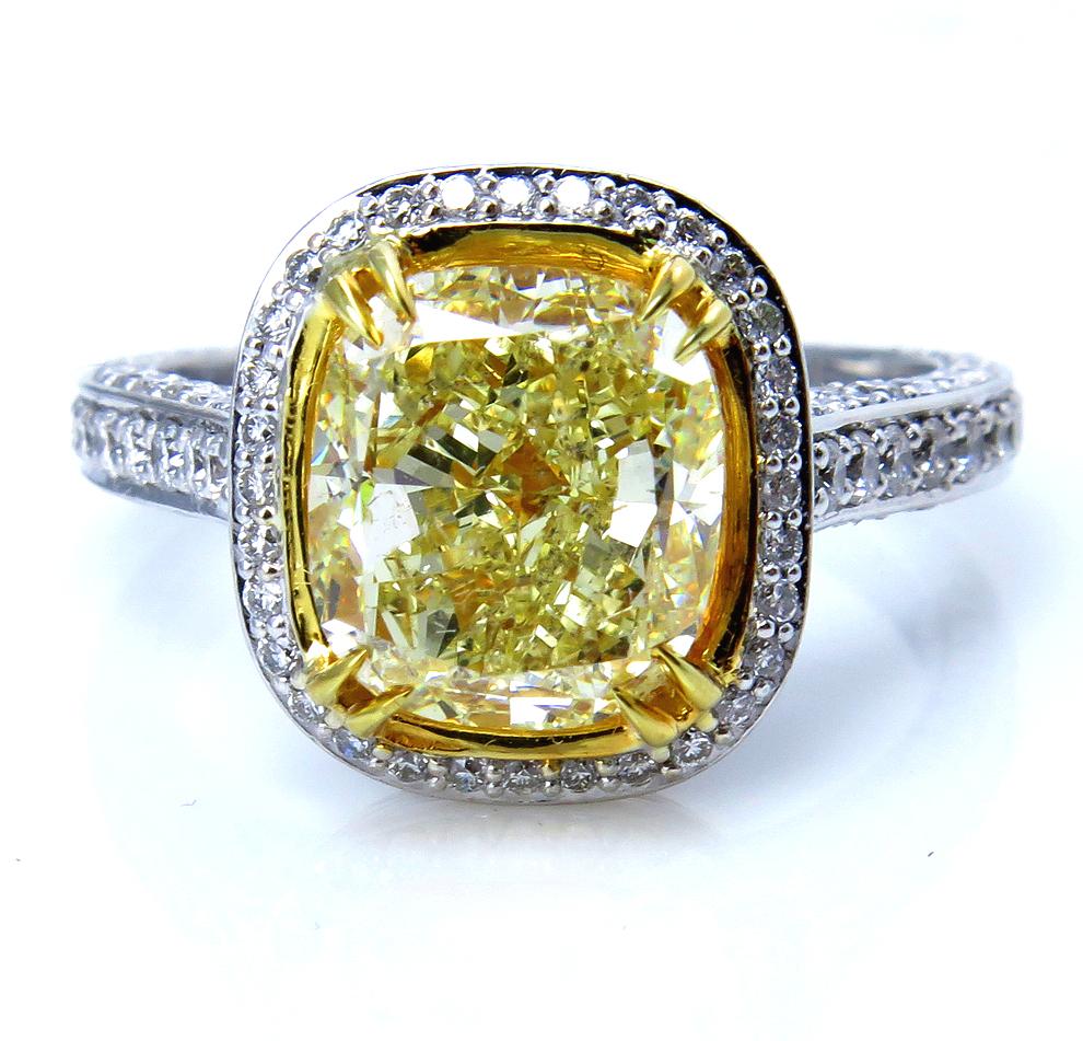 This is ring is just Beautiful! A beams of sunshine radiate day and night from this fabulous dazzler with gorgeous center natural fancy color diamond is ignited by bright white diamonds that shimmer with real sparkle and flair. Exclusive,