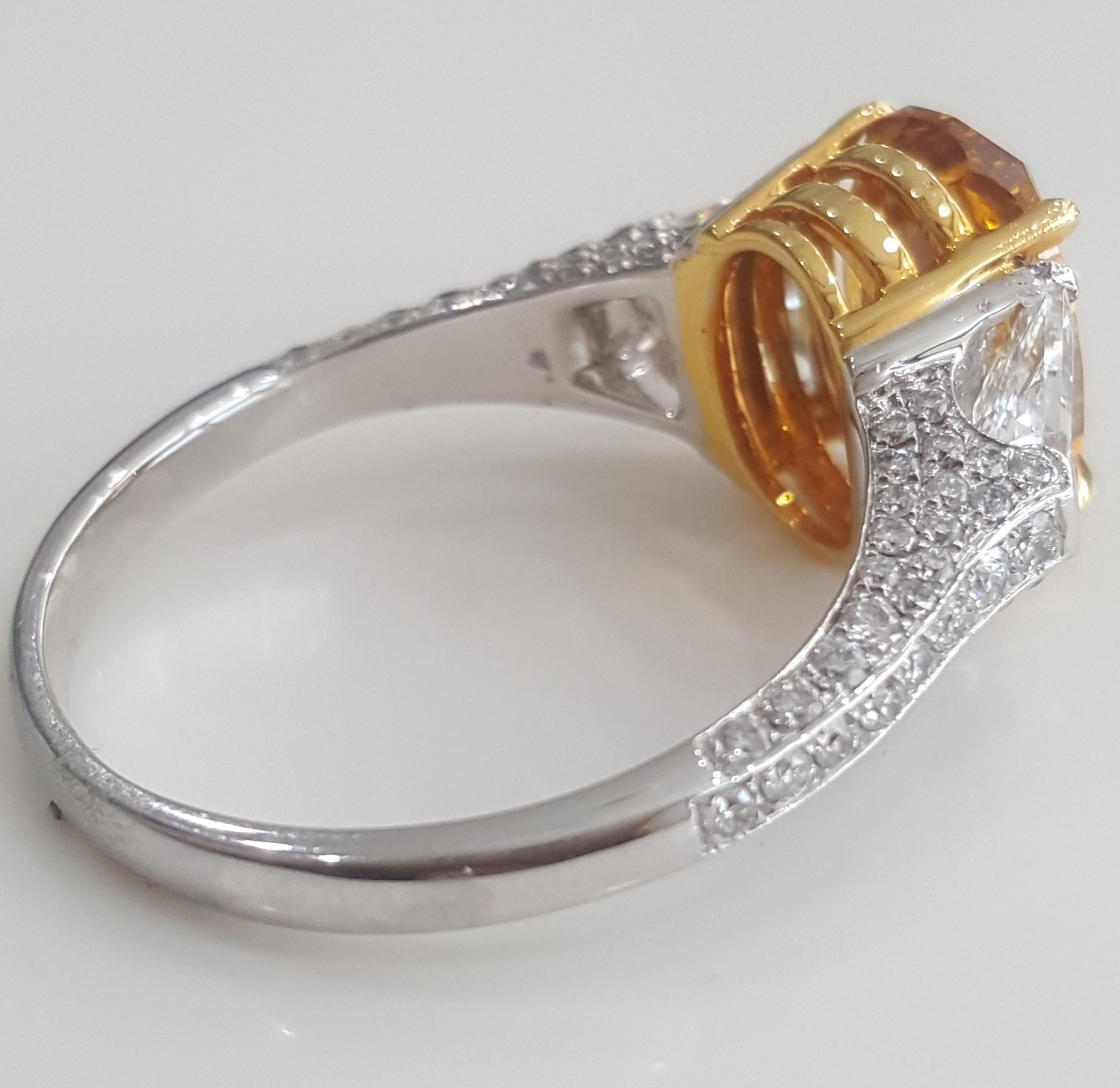 Contemporary GIA 4.43 Carat Natural Fancy Deep Orange Yellow Oval And White Diamond Ring.  For Sale