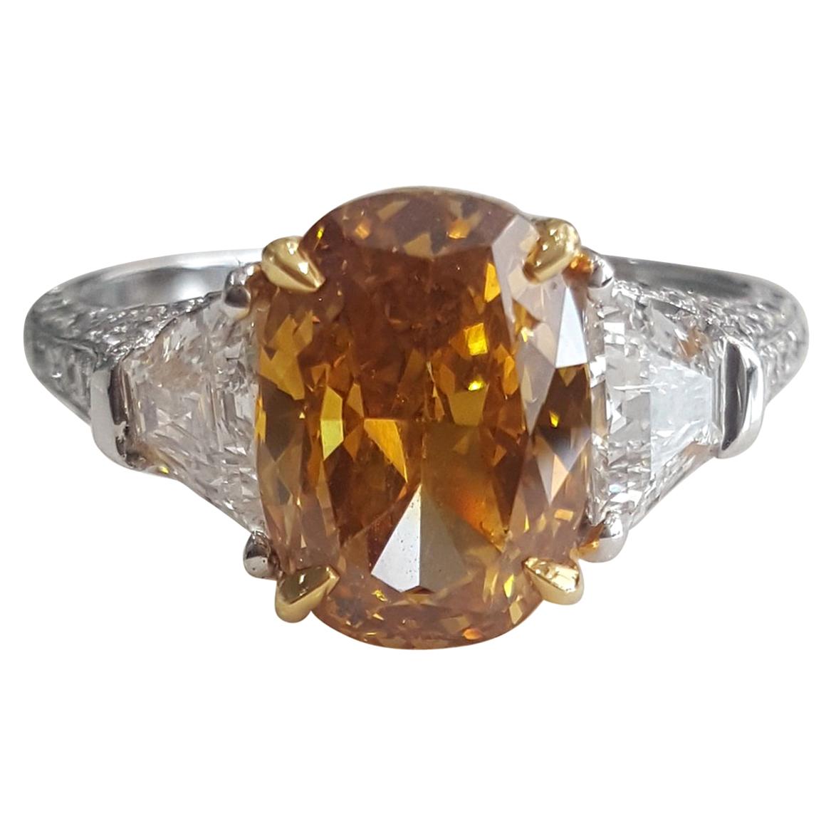GIA 4.43 Carat Natural Fancy Deep Orange Yellow Oval And White Diamond Ring.  For Sale