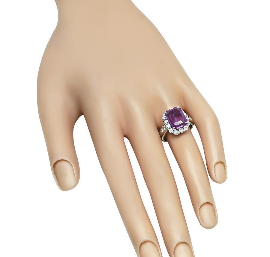 This is gorgeous platinum engagement ring. The ring is centered with lovely GIA certified natural no heat pink sapphire that weighs 4.60ct. The sapphire is accentuated by sparkling round cut diamonds that weigh approximately 1.19ct. The color of